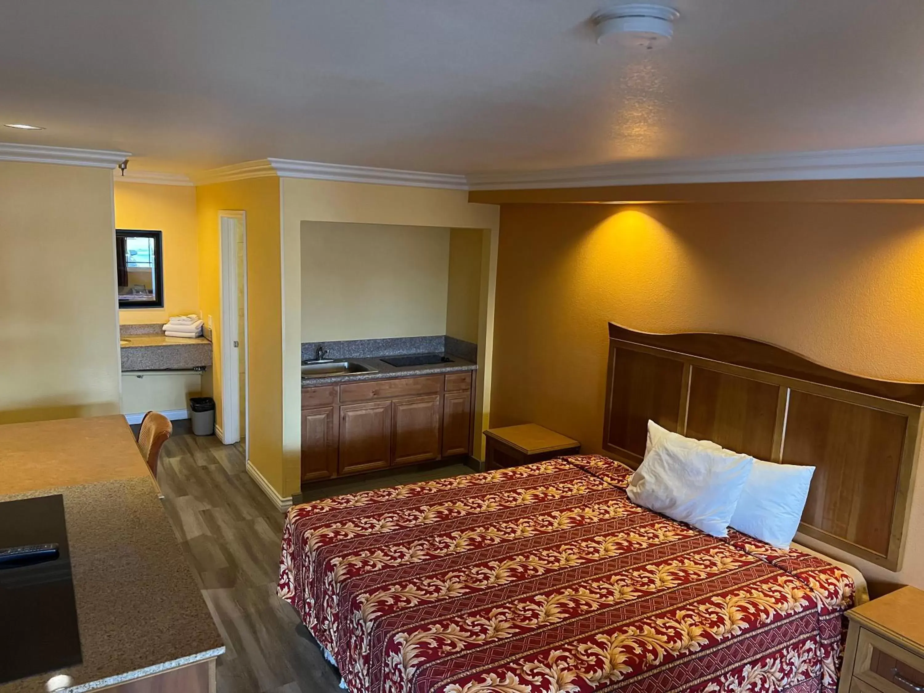 Bed in Industry Inn & Suites Bed in Industry Inn & Suites