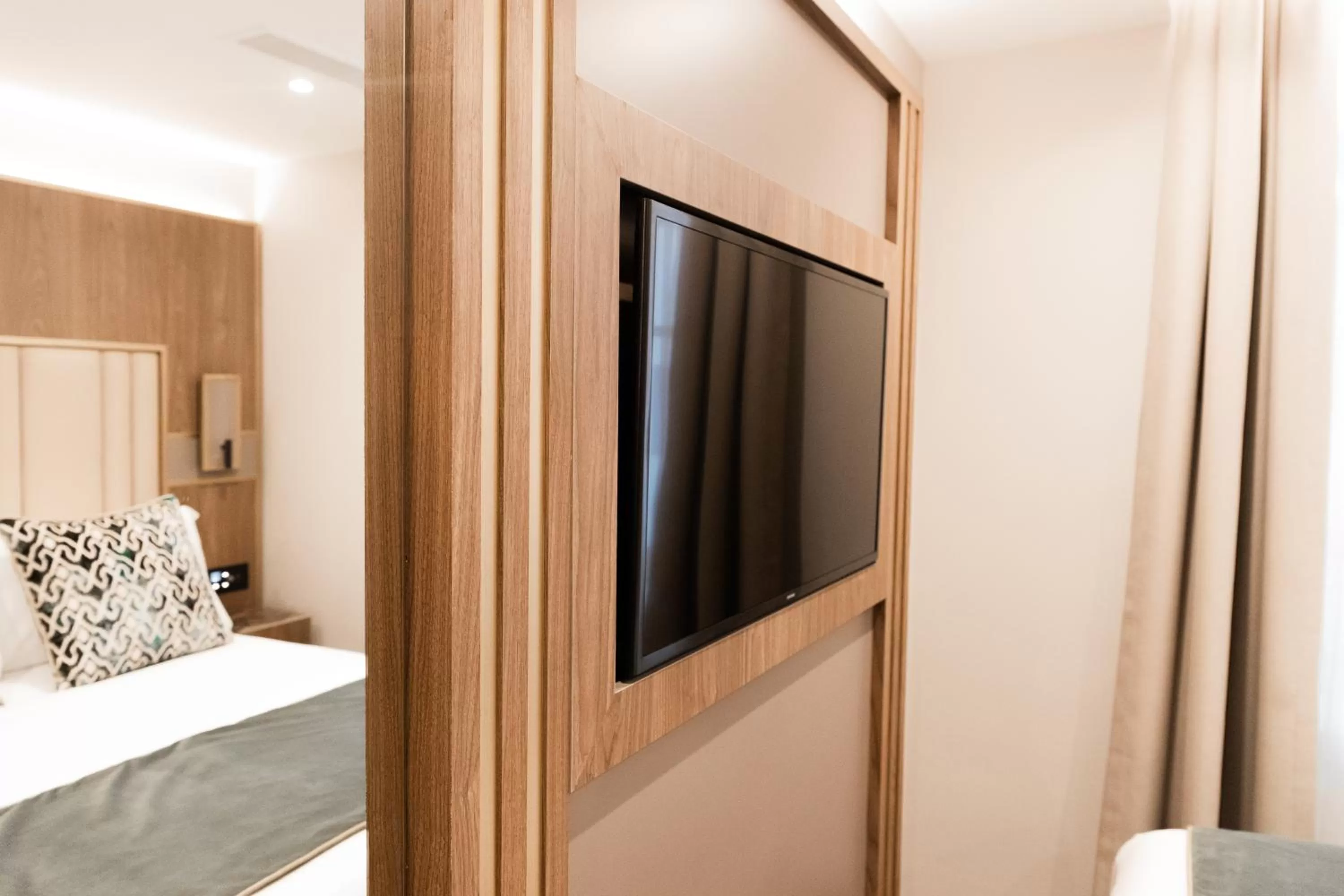 Bed in Merit Kensington Hotel