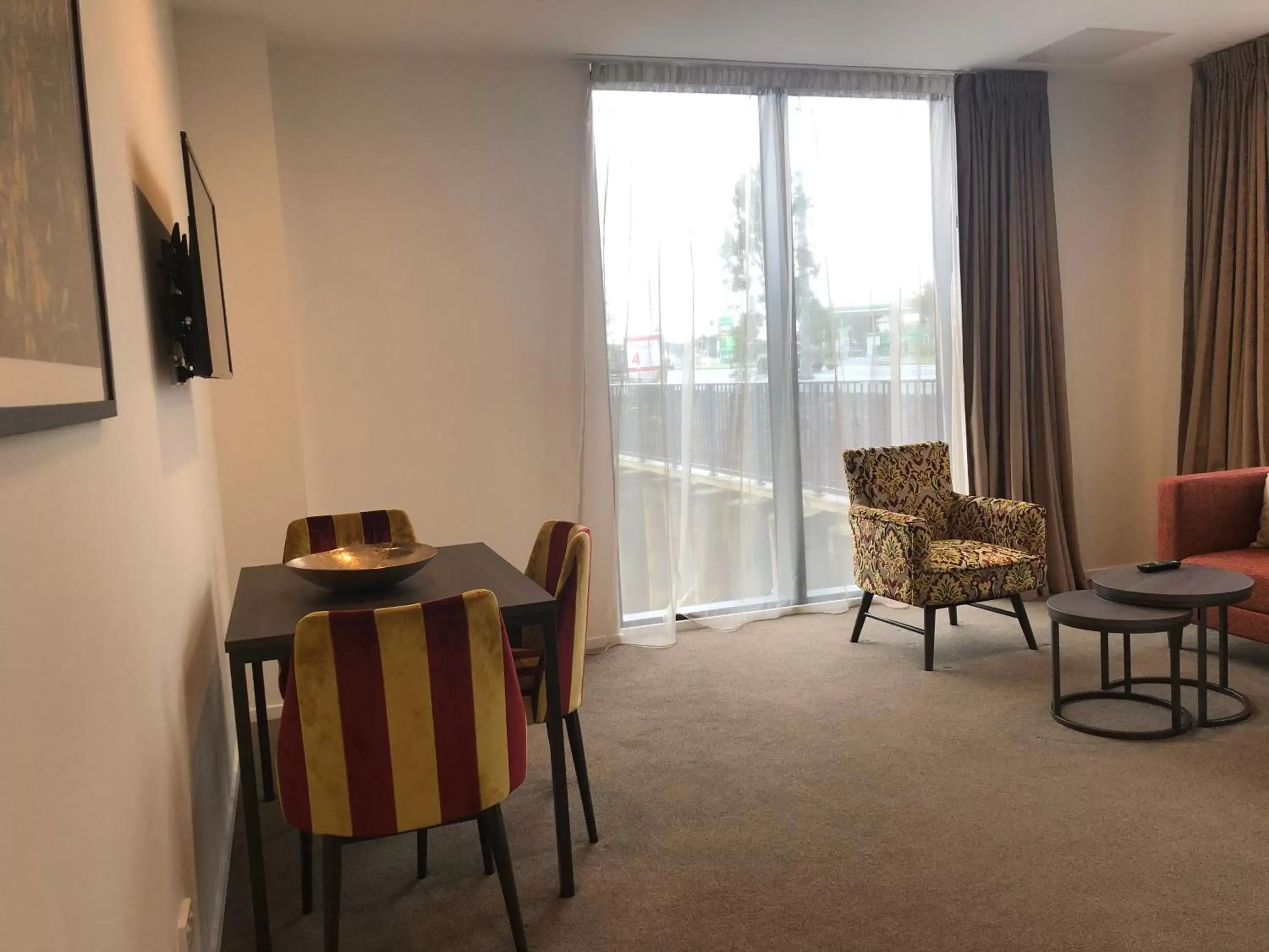 Living room, Dining Area in Ramada Suites by Wyndham Manukau