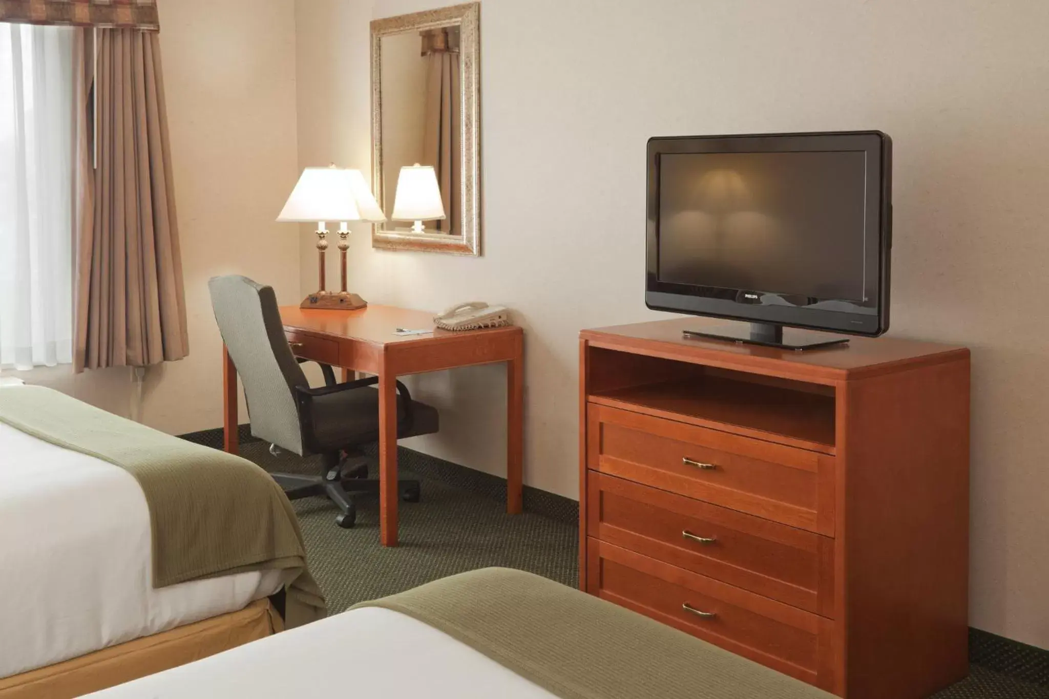 Photo of the whole room, TV/Entertainment Center in Holiday Inn Express Hotel & Suites Bryan-Montpelier, an IHG Hotel