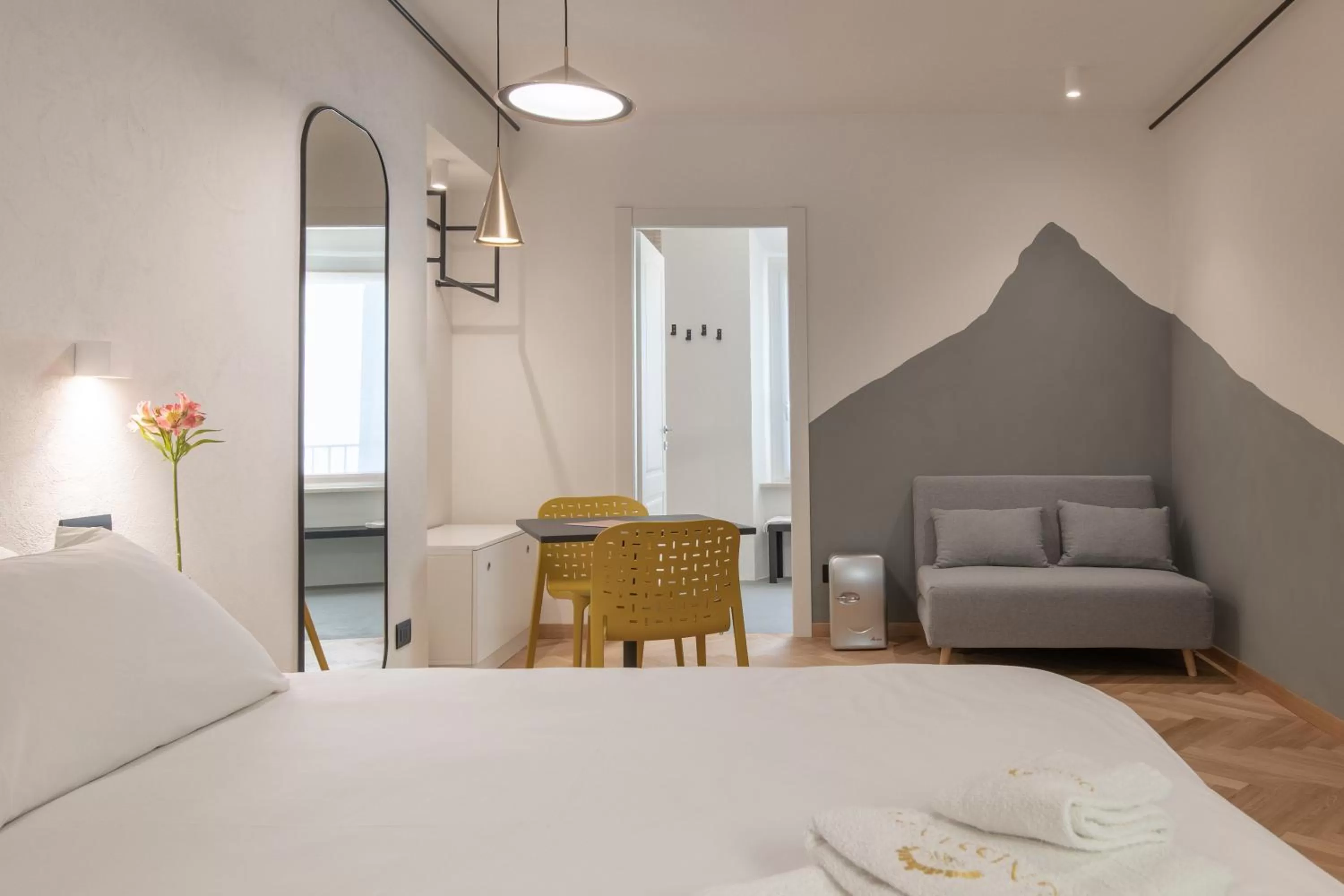 Bed in OGNISSANTI GuestHouse & Suites