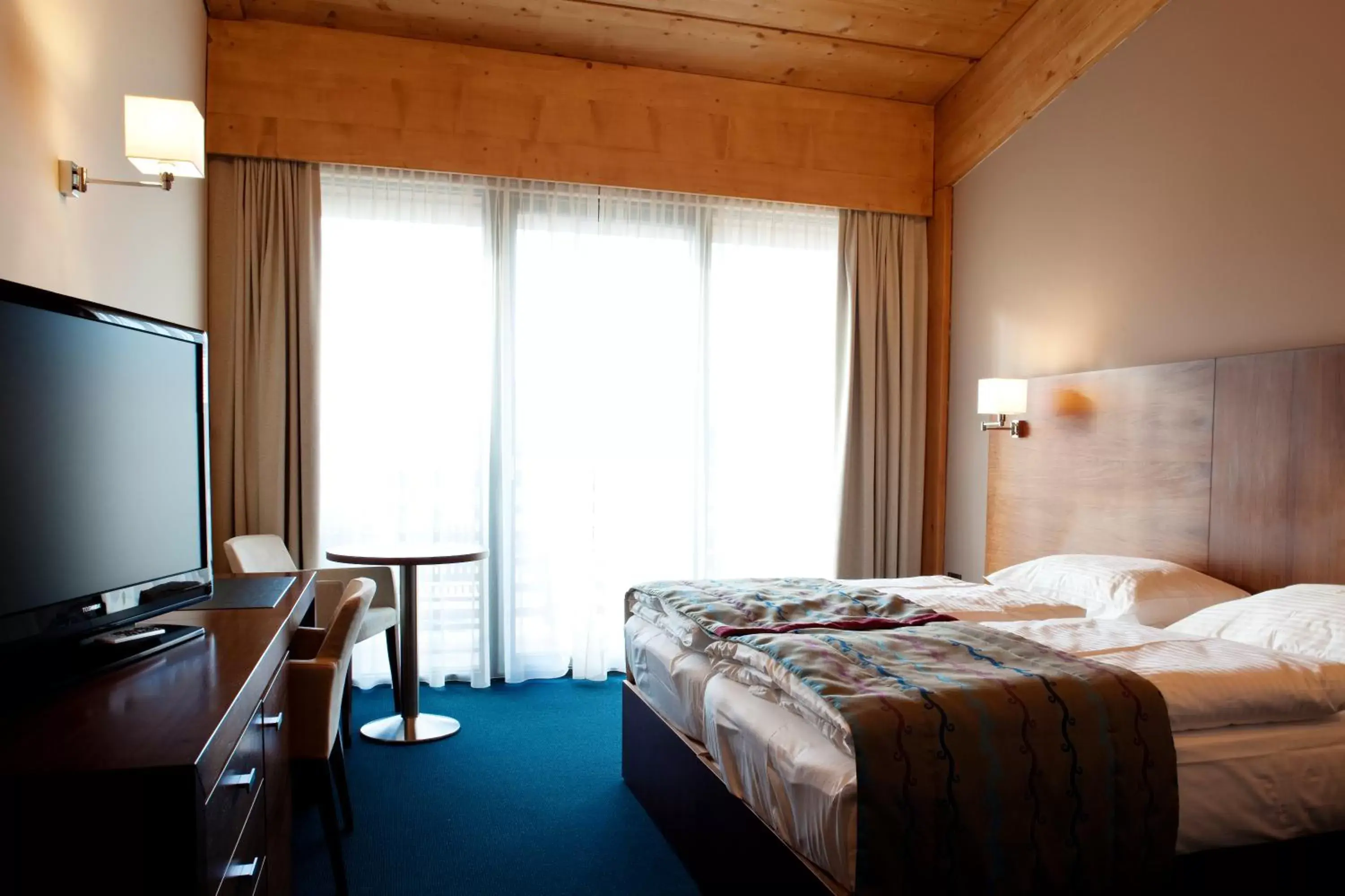 Deluxe Double or Twin Room with Balcony and Aquapark Included in Bohinj Eco Hotel