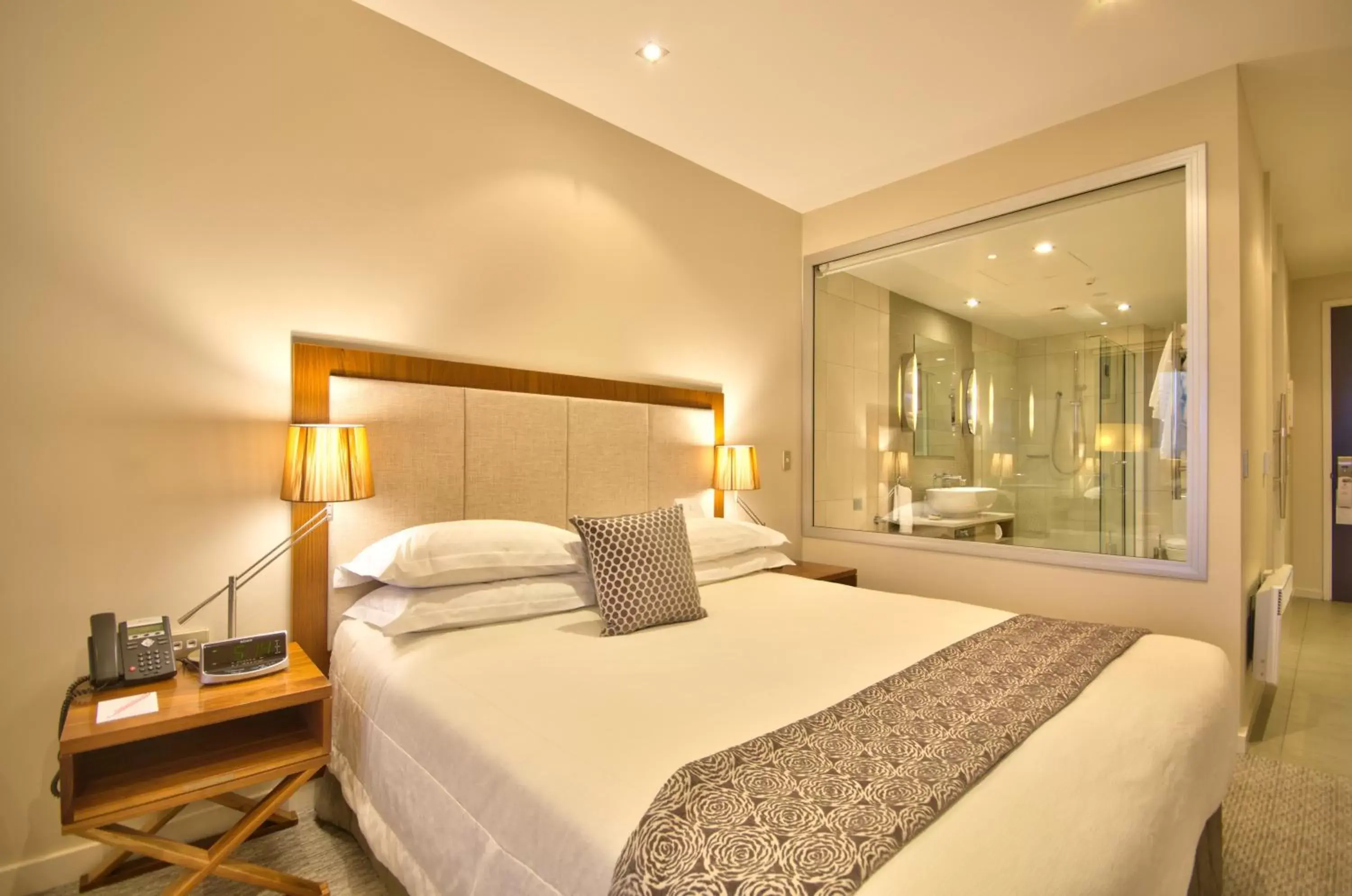 Bed in The Rees Hotel & Luxury Apartments