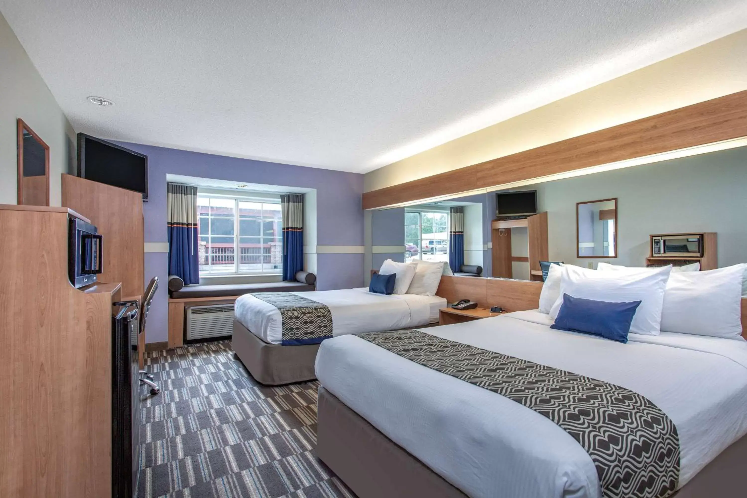 Photo of the whole room, Bed in Microtel Inn & Suites by Wyndham Lillington/Campbell University Photo of the whole room, Bed in Microtel Inn & Suites by Wyndham Lillington/Campbell University