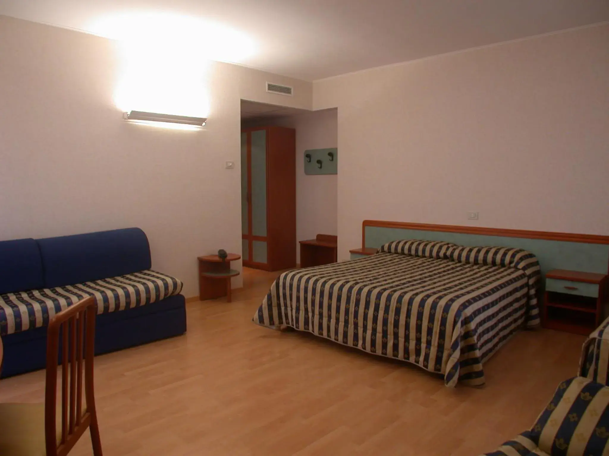 Bedroom in Hotel La Pergola