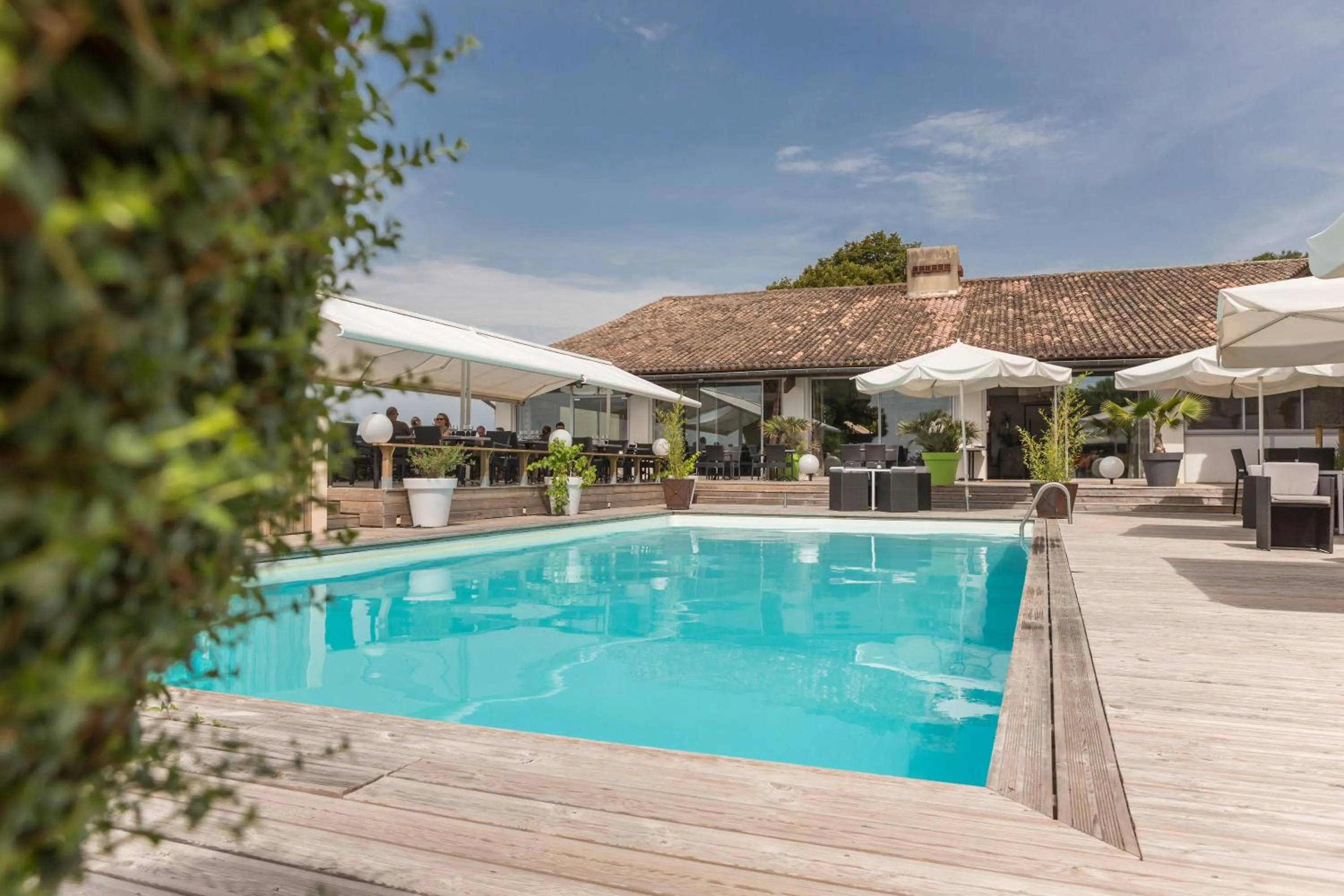 Swimming pool in Logis Hôtel Restaurant La Citadelle