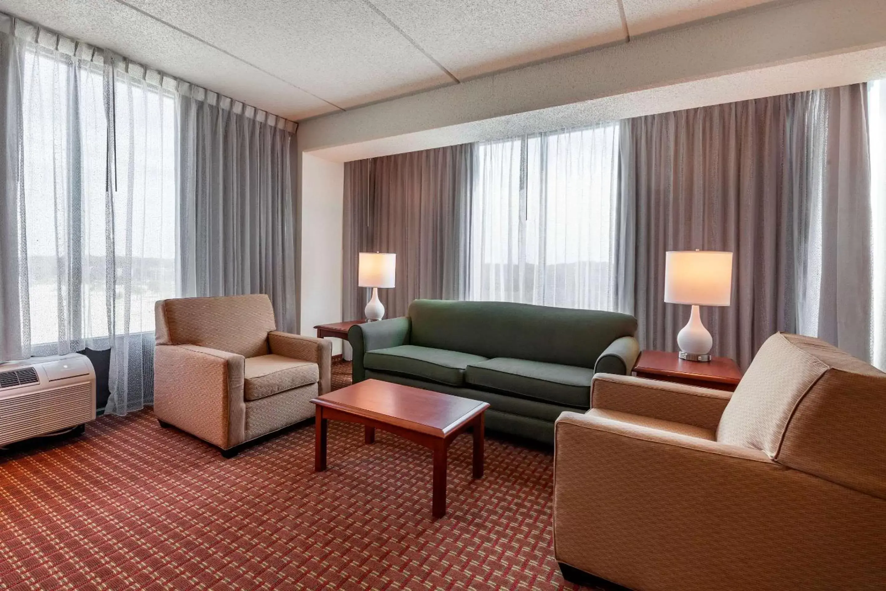 Bedroom, Seating Area in Clarion Suites at The Alliant Energy Center