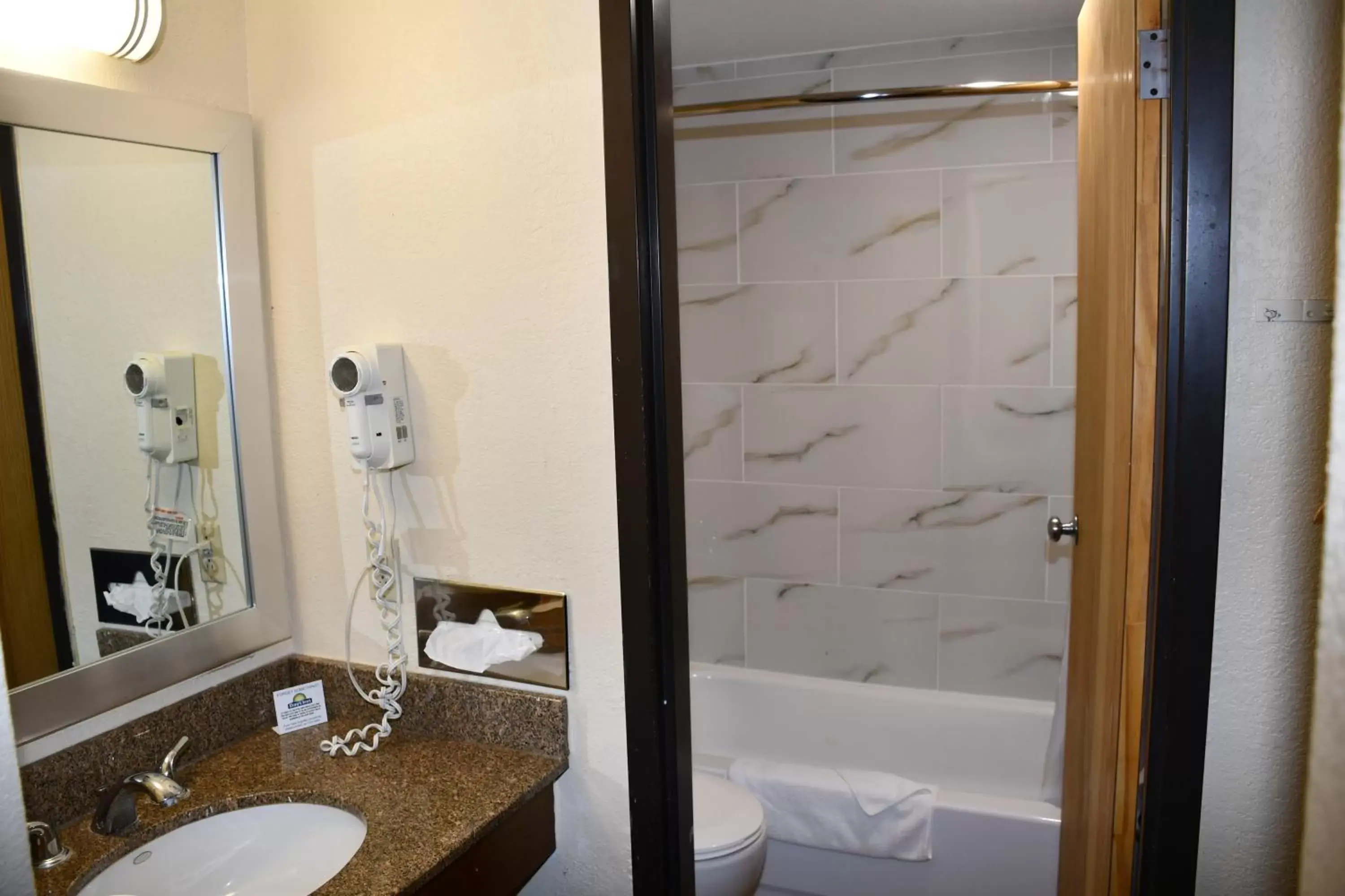 Bathroom in Days Inn by Wyndham Mounds View Twin Cities North