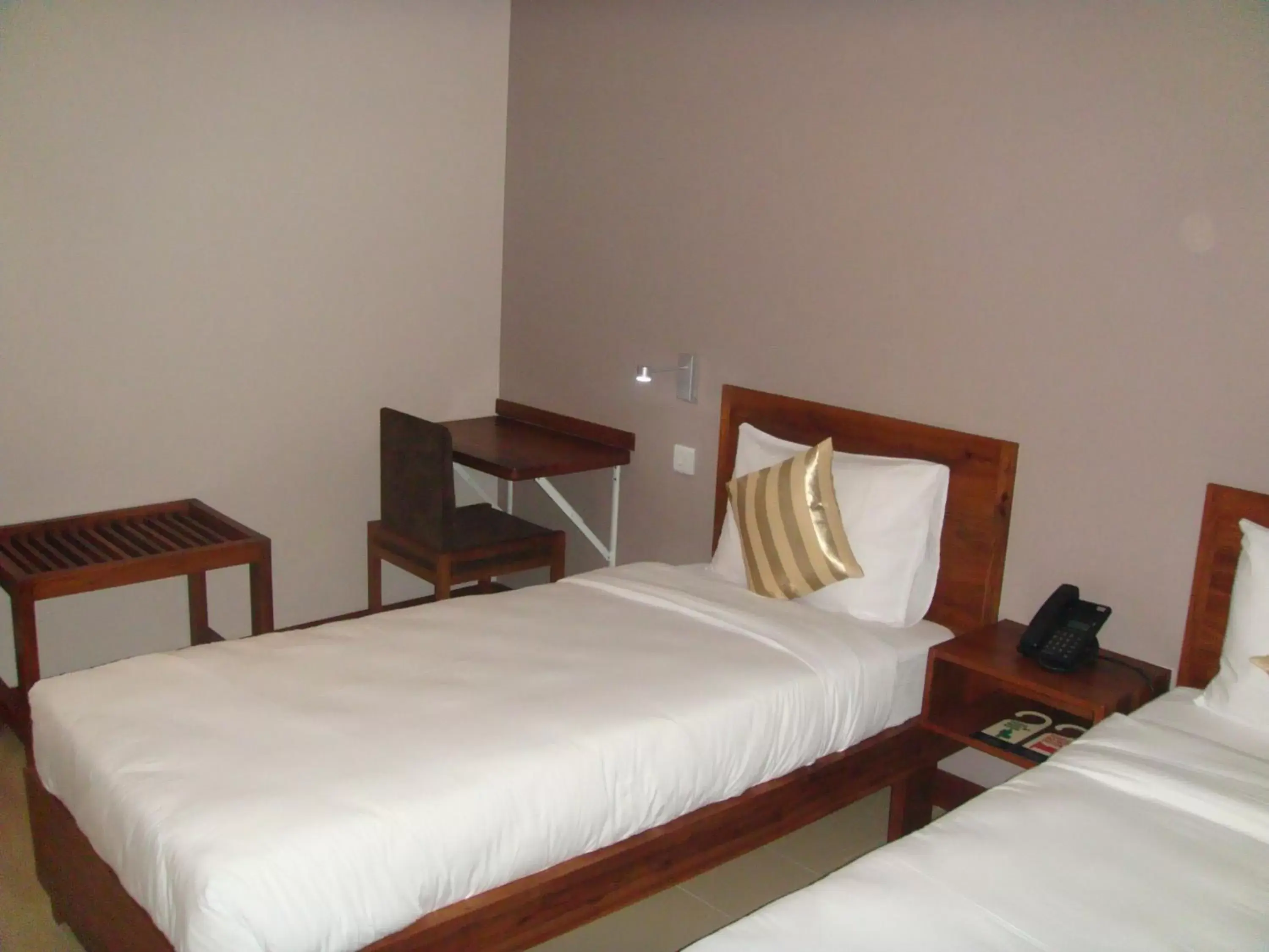 Bed in Venus Premier Hotel