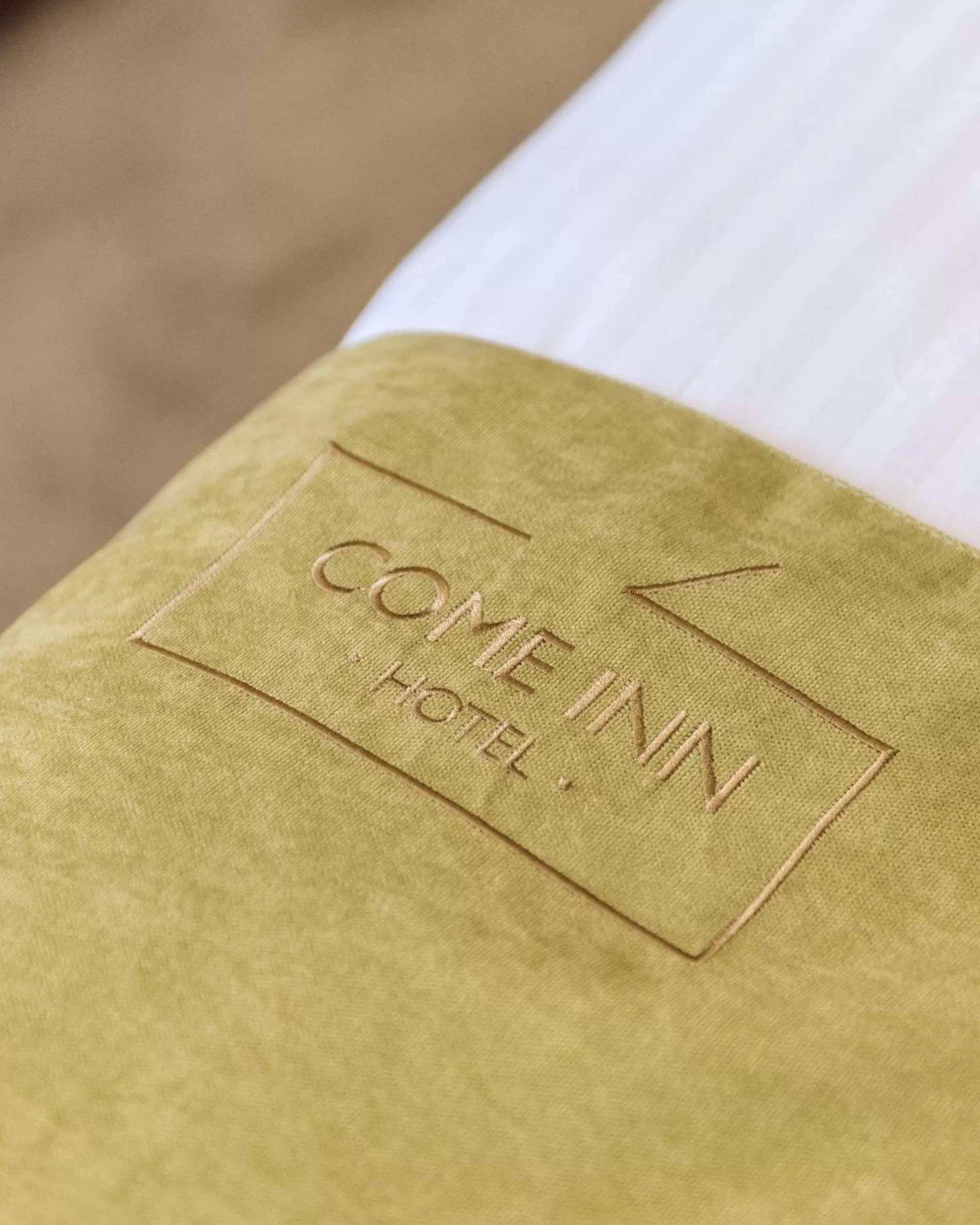 Property logo or sign in Come INN