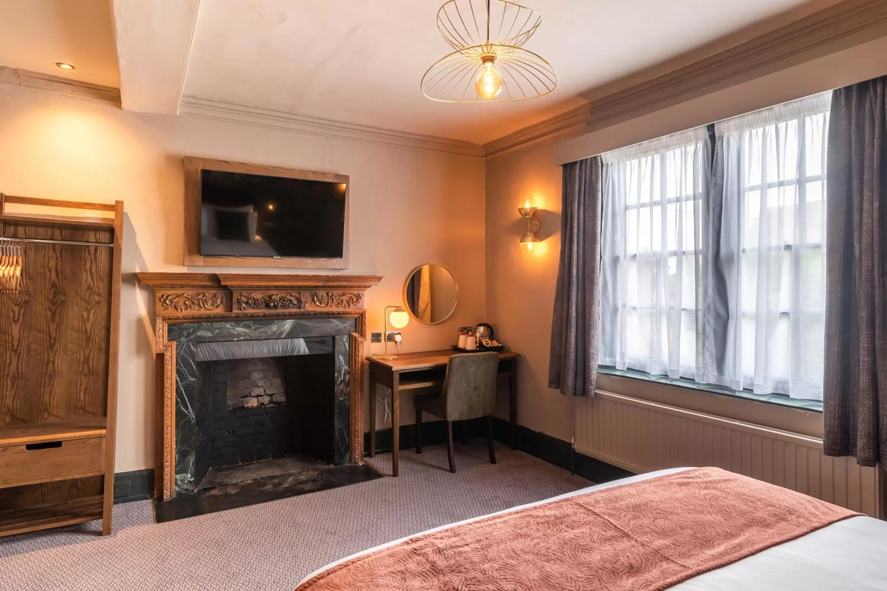 Bed, TV/Entertainment Center in The Bell by Innkeeper's Collection