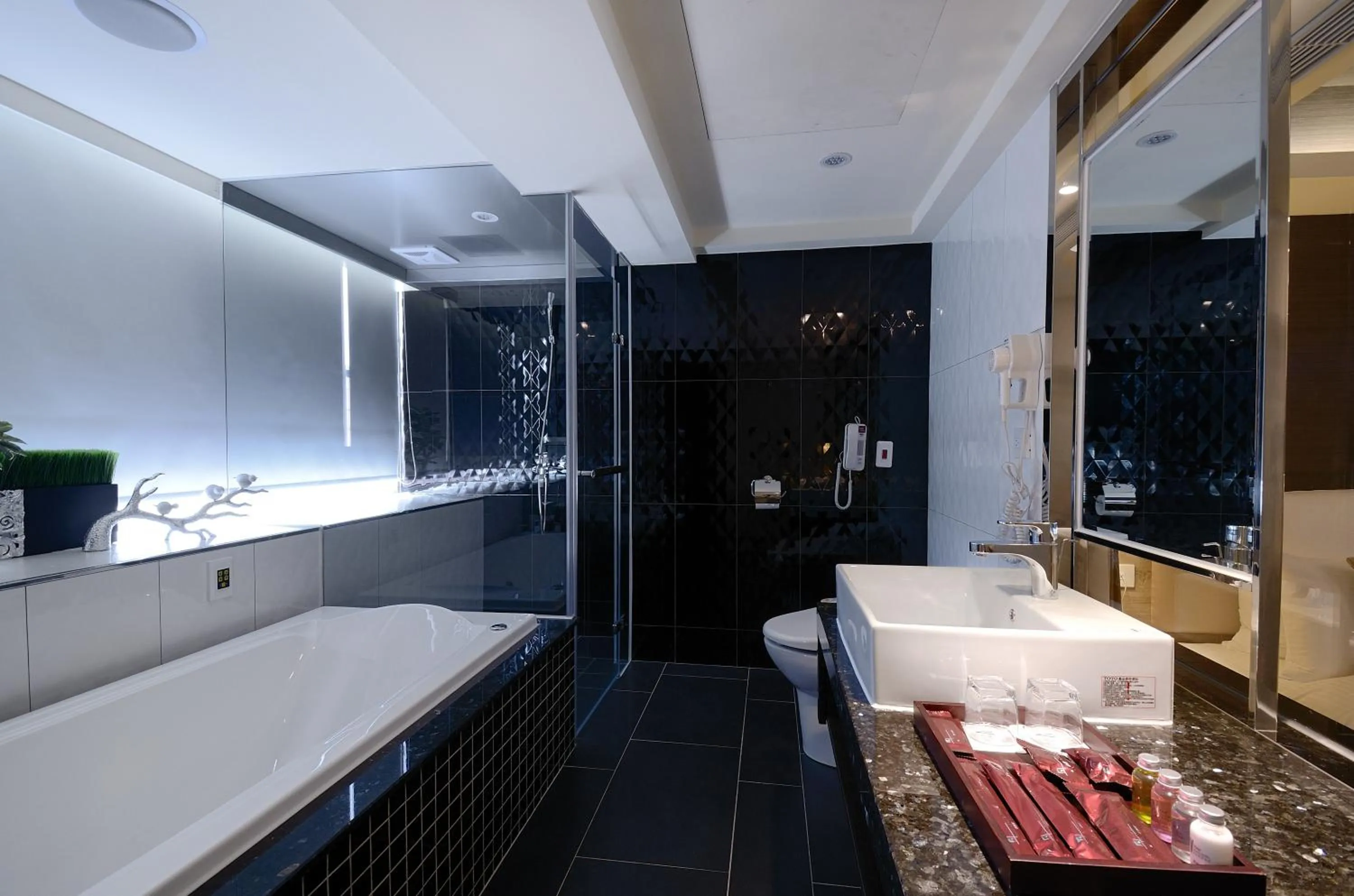 Bathroom in V-one Vogue Hotel