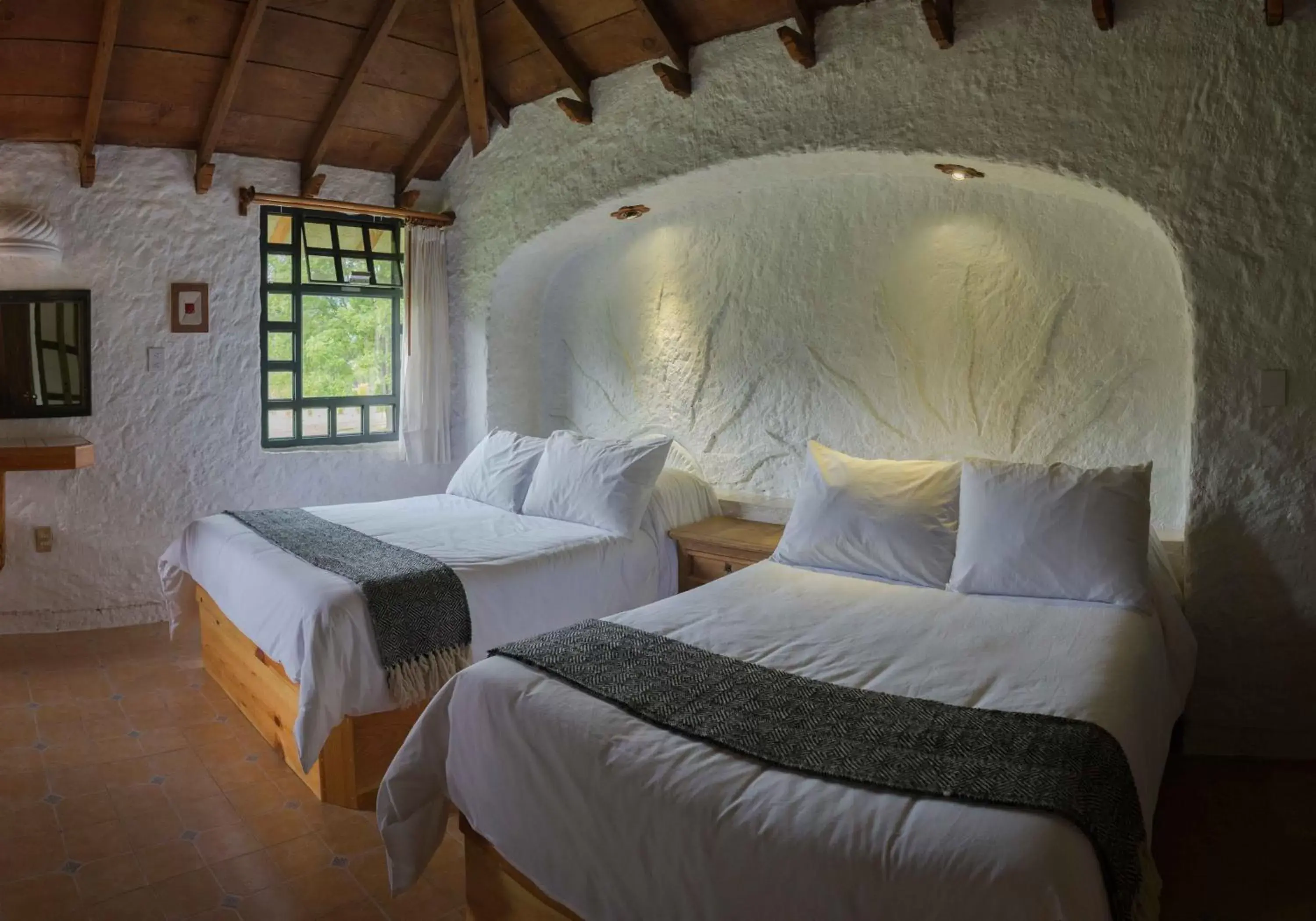 Bed in Hotel Bosques del Sol Suites