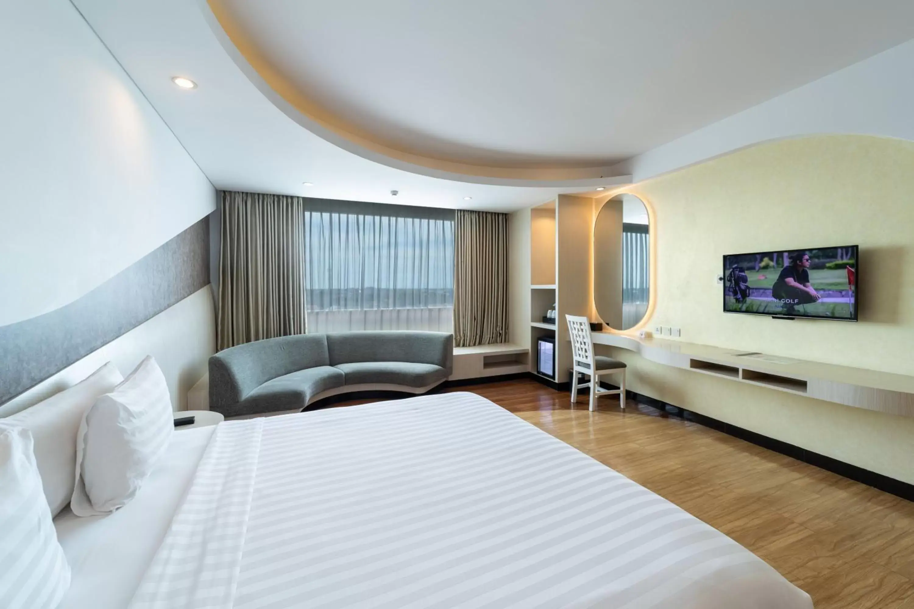 Bed, TV/Entertainment Center in ASTON Cirebon Hotel and Convention Center