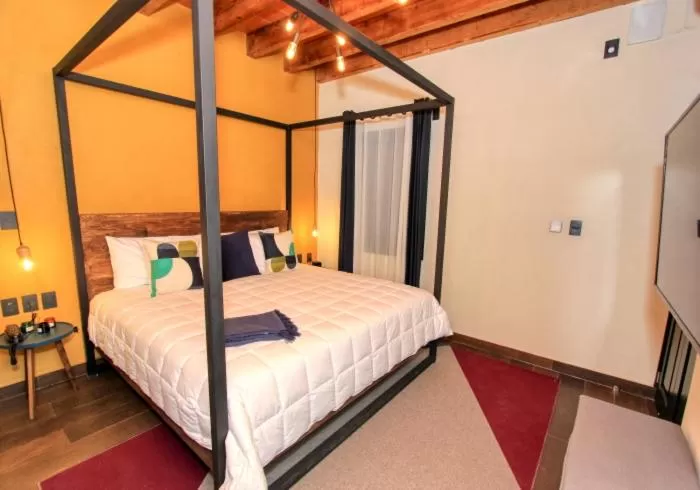 Bed in Antigua Trece Hotel Fusión