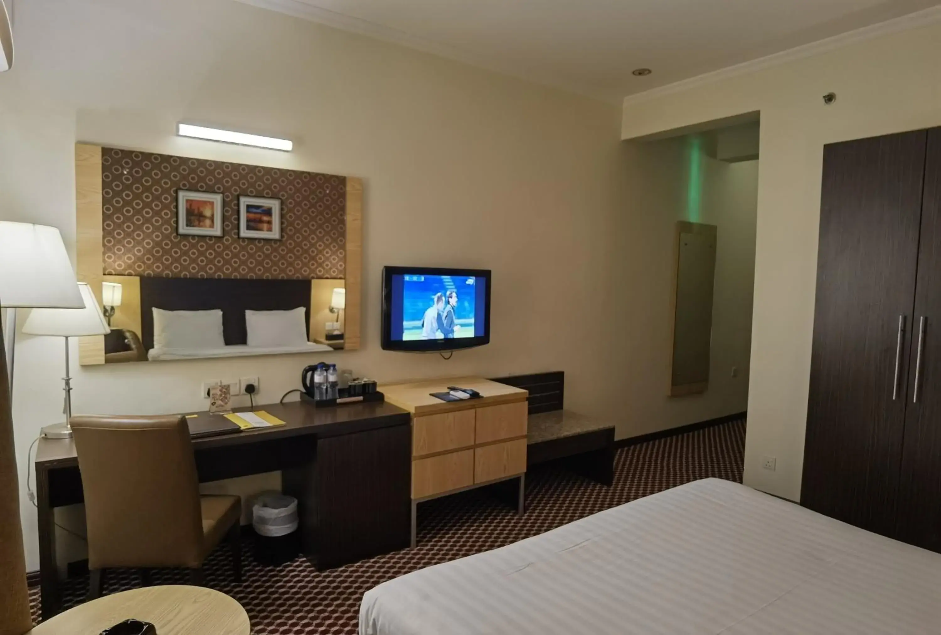 Bedroom, TV/Entertainment Center in Fortune Karama Hotel