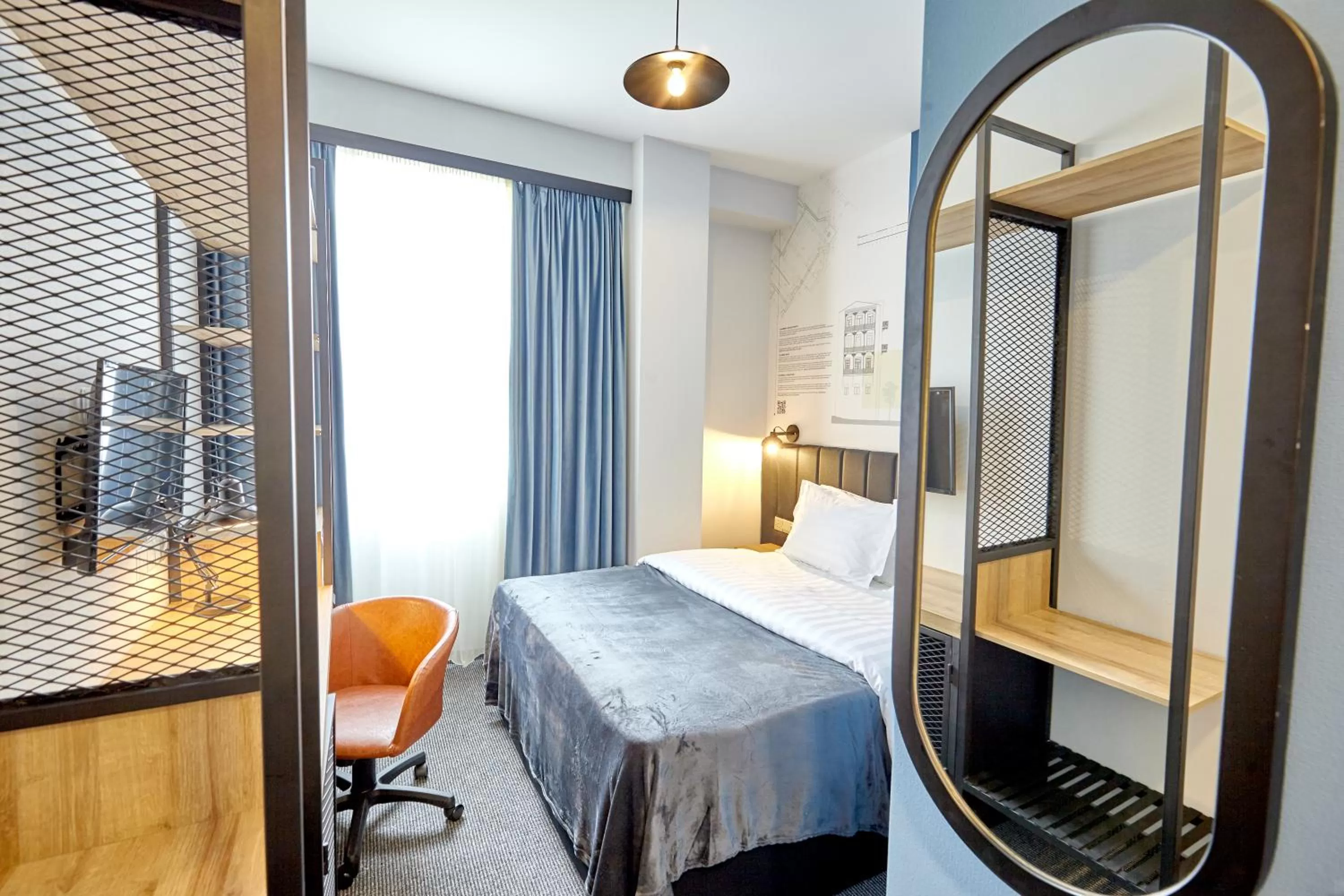 Bed in Graphica Tbilisi Hotel