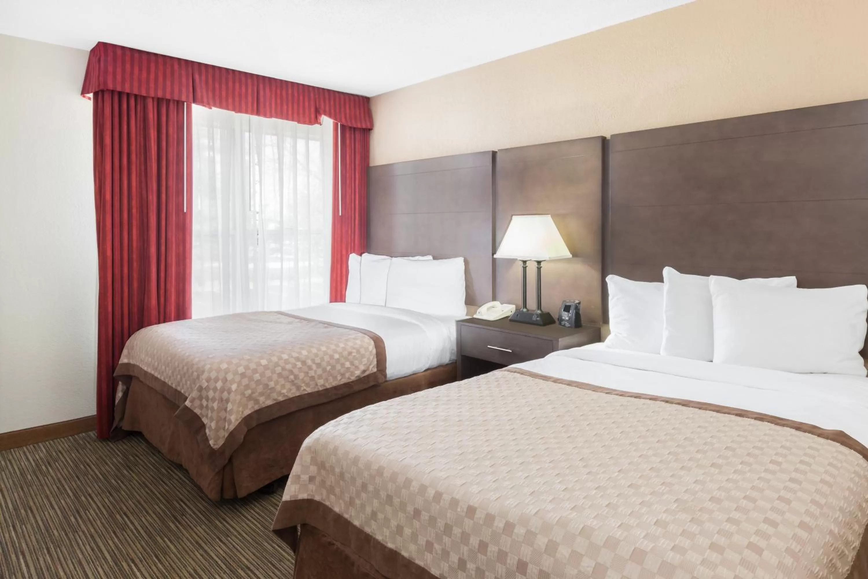 Photo of the whole room, Bed in Affordable Suites of America Detroit-Warren