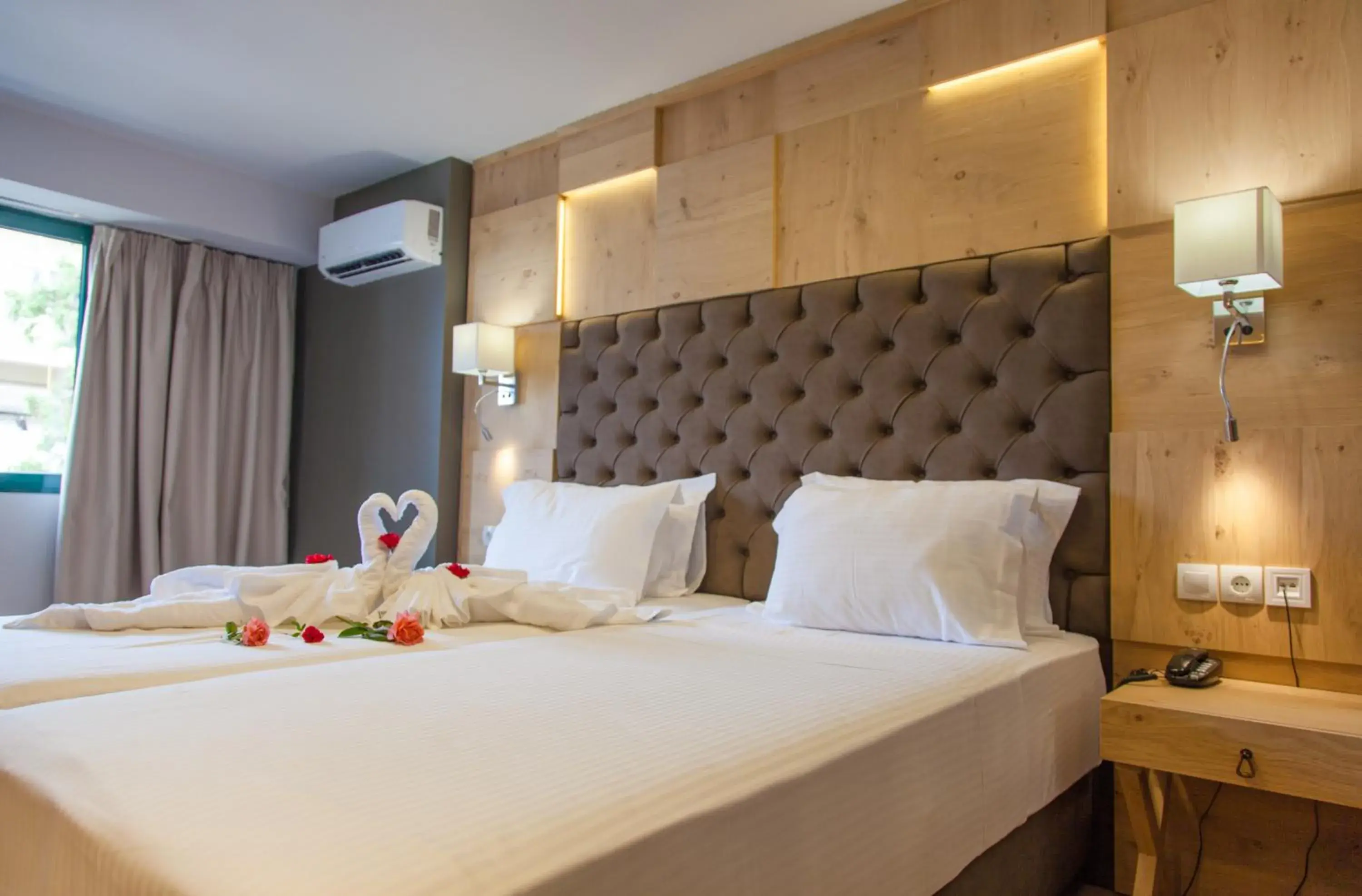 Bed in Elmi Beach Hotel & Suites