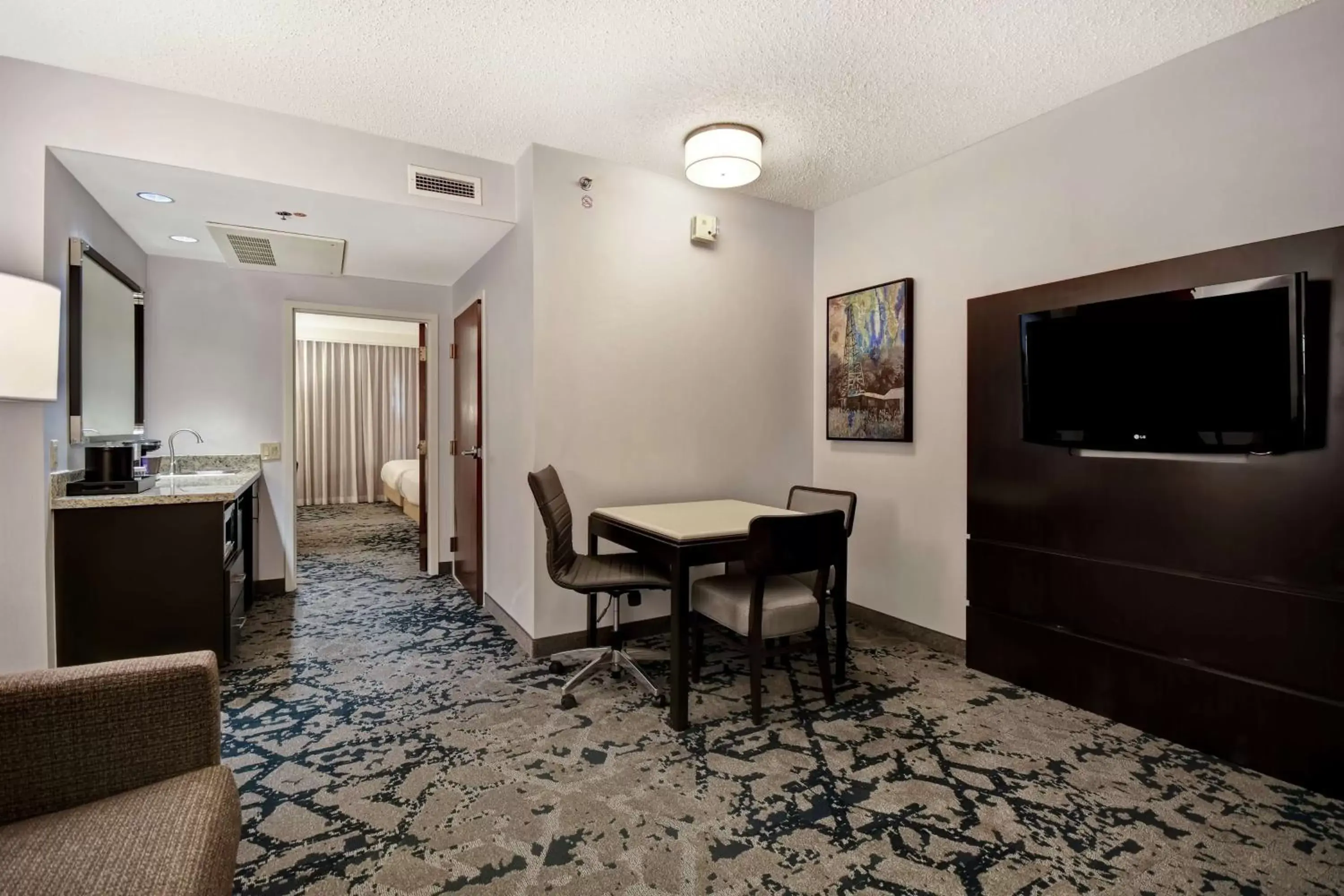 Living room, Dining Area in Embassy Suites Charleston