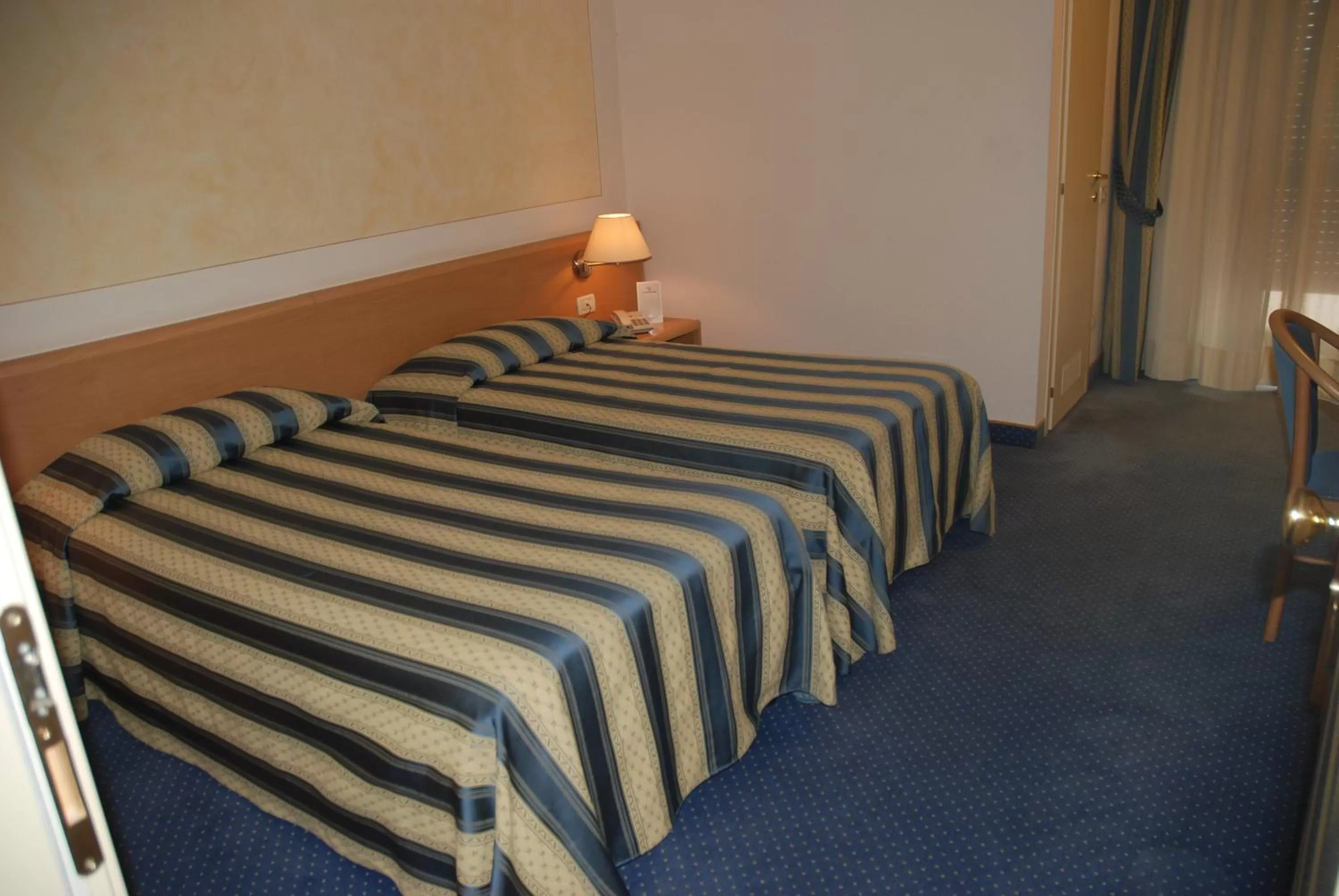 Bed in Hotel Continental Brescia