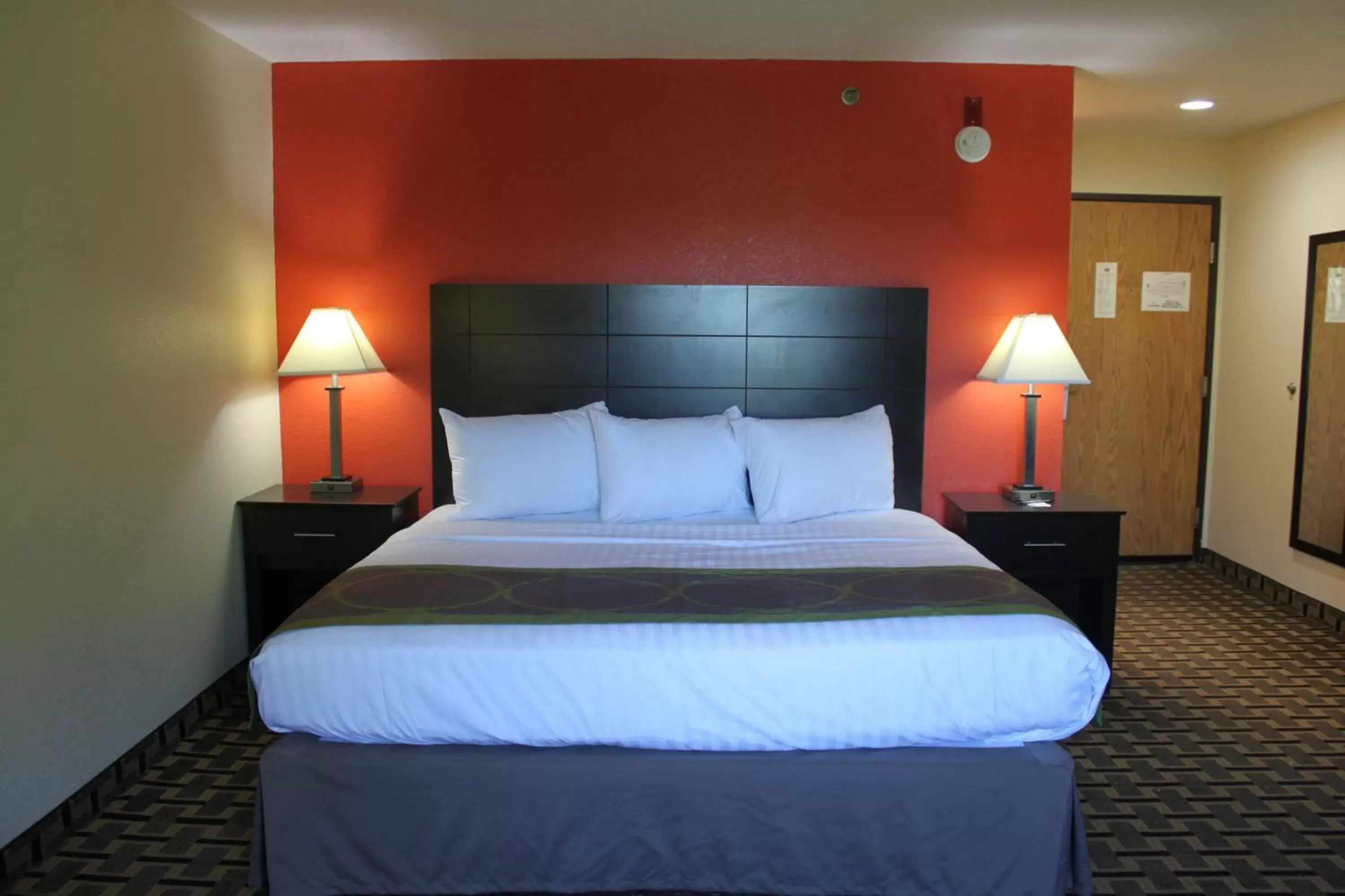 Bed in AmericInn by Wyndham West Burlington