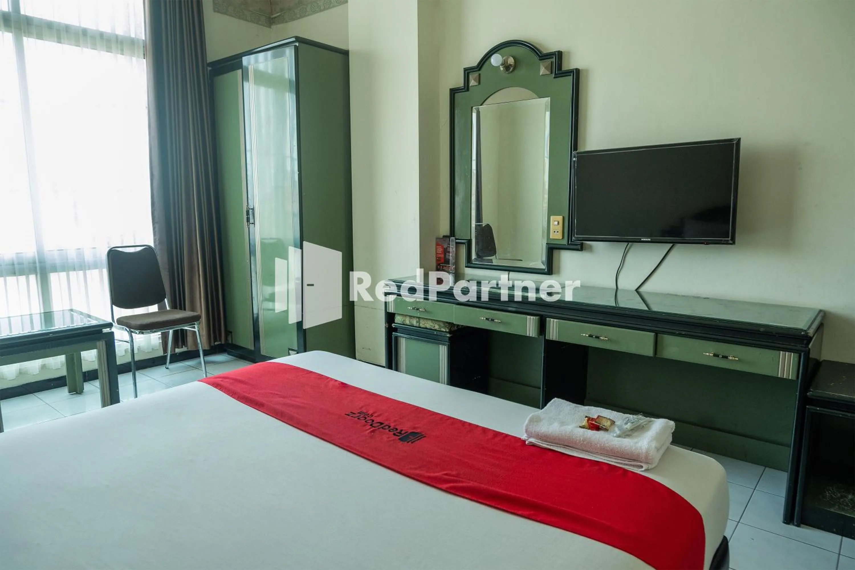 Bed in Akur Hotel Malioboro Mitra RedDoorz