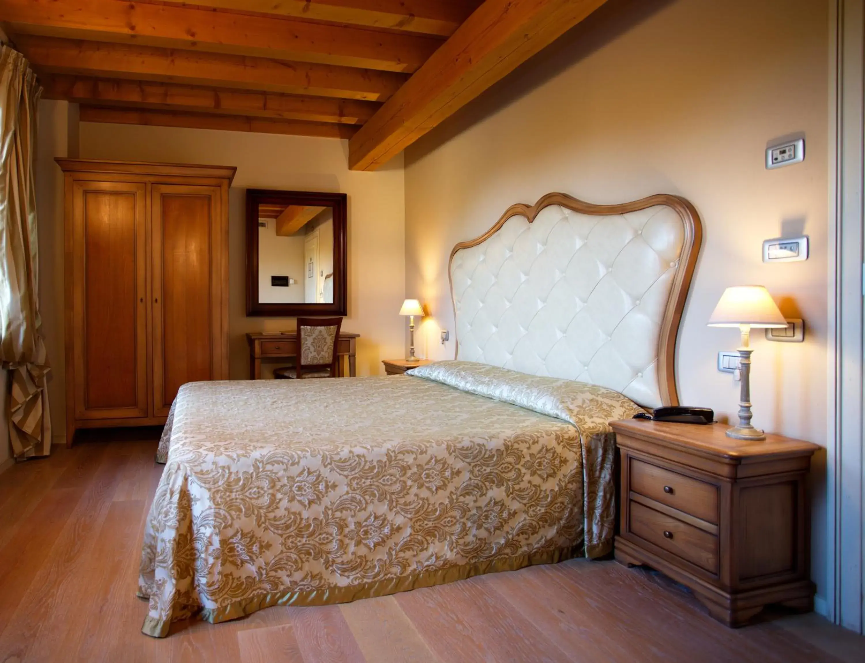 Bed in Hotel Asolo