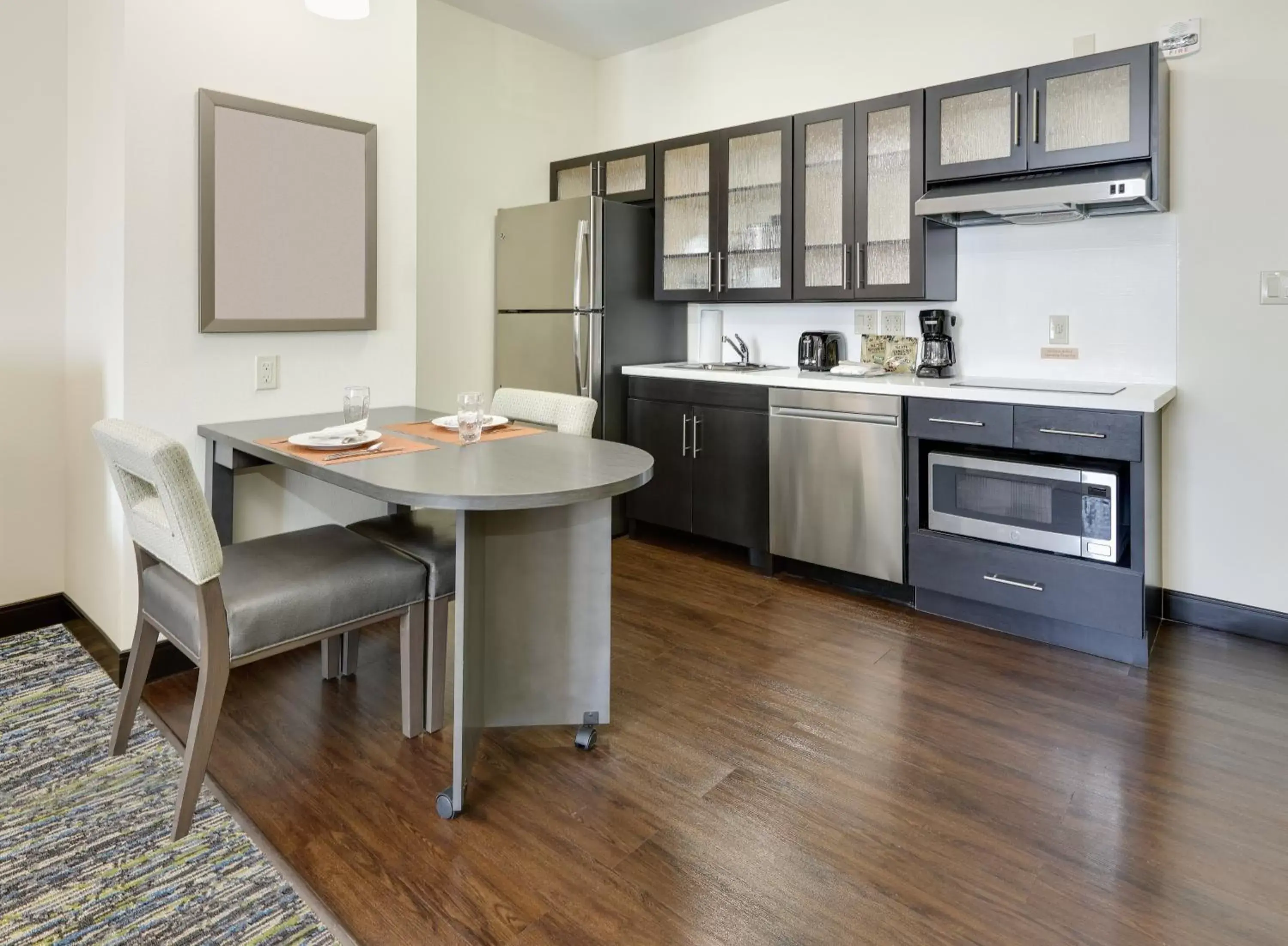 Photo of the whole room, Kitchen/Kitchenette in Candlewood Suites - Farmers Branch, an IHG Hotel