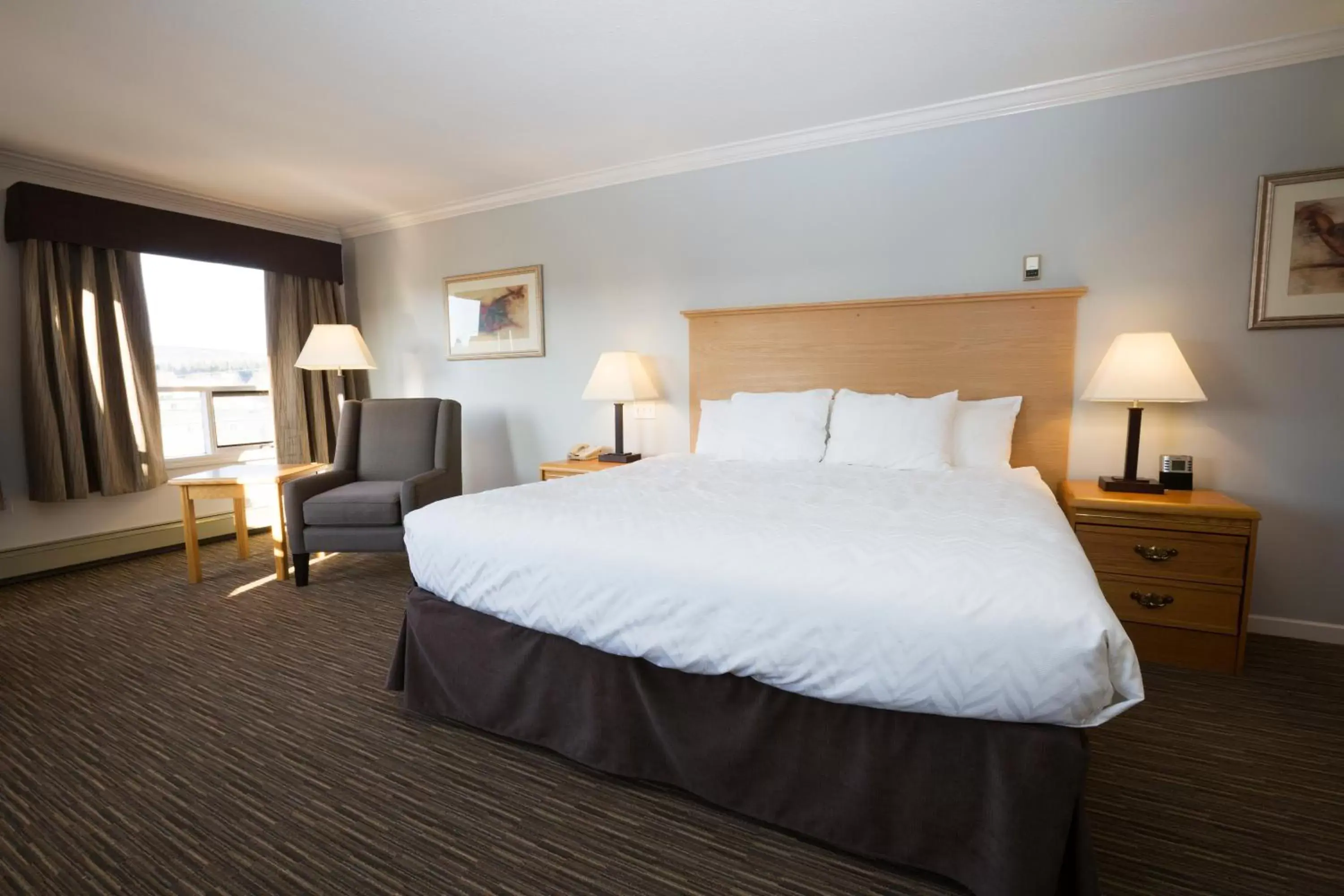 Bed in Tower Inn & Suites