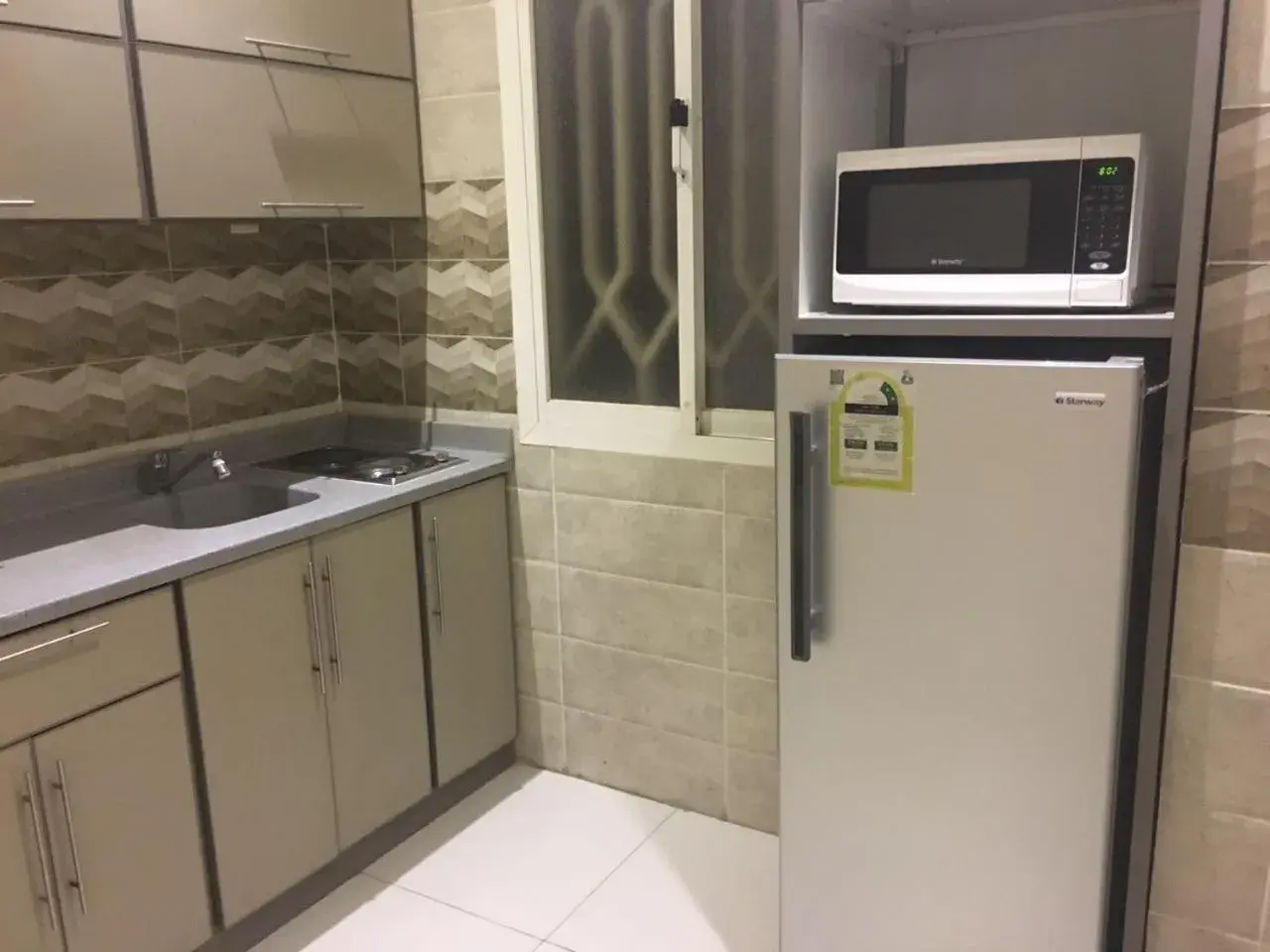 Kitchen/Kitchenette in Taleen Al Nakheel Apartment