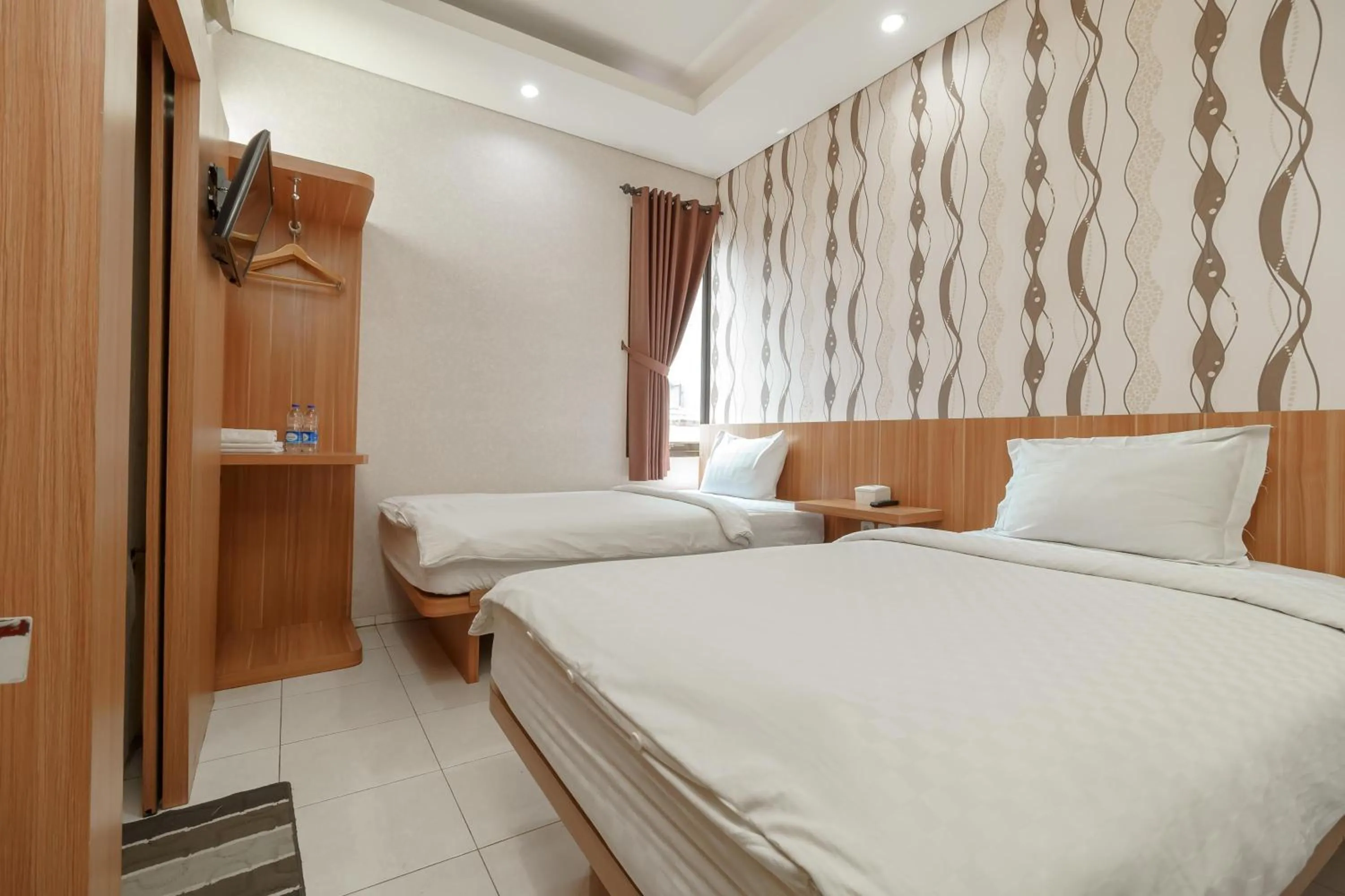 Bed in Green Apple Residence near Sarinah Mitra RedDoorz