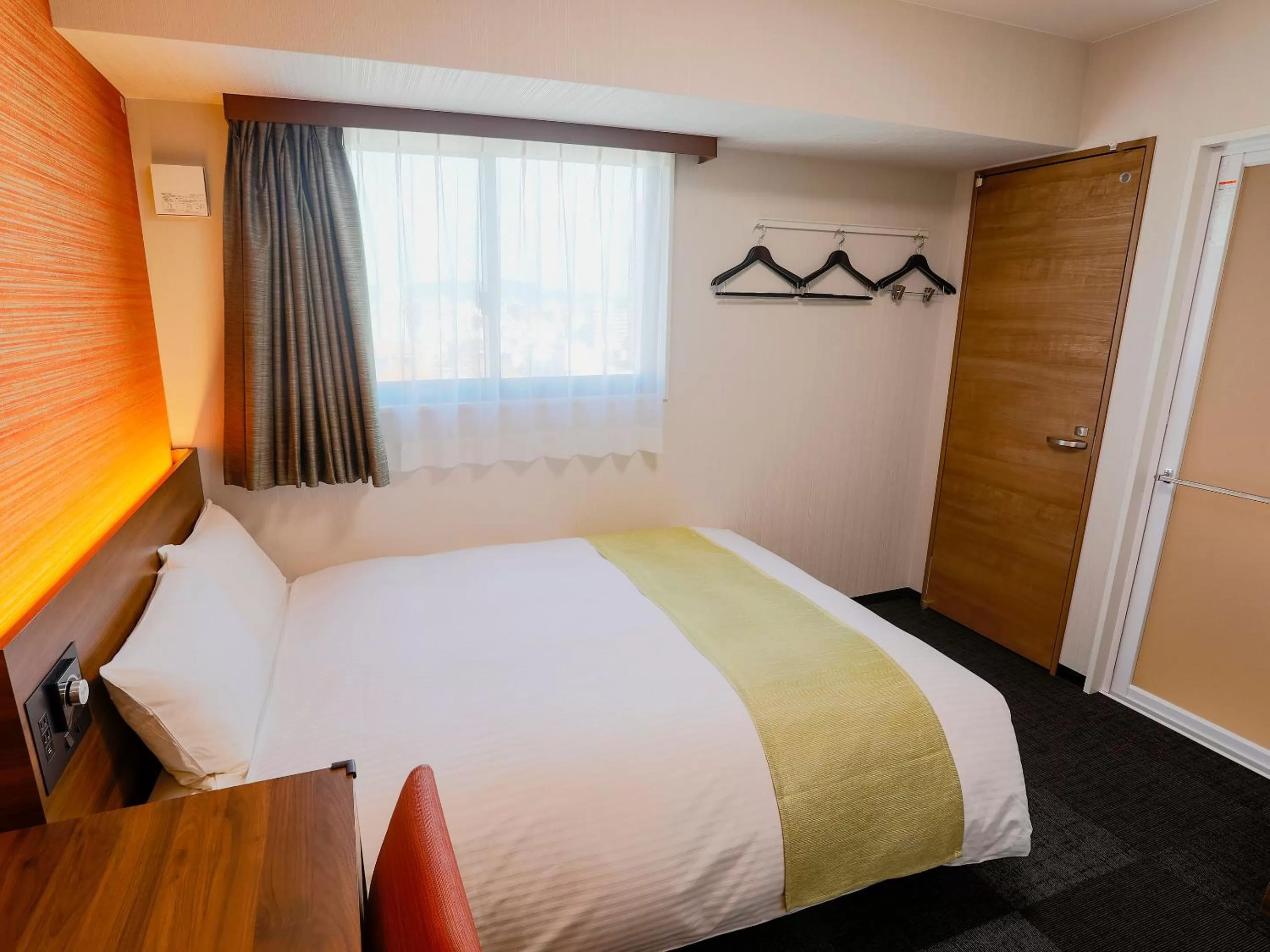 Bed in KOKO HOTEL Takamatsu - formerly Hotel Wing Takamatsu