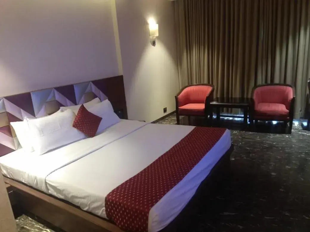 Bed in Quality Inn Regency, Nashik