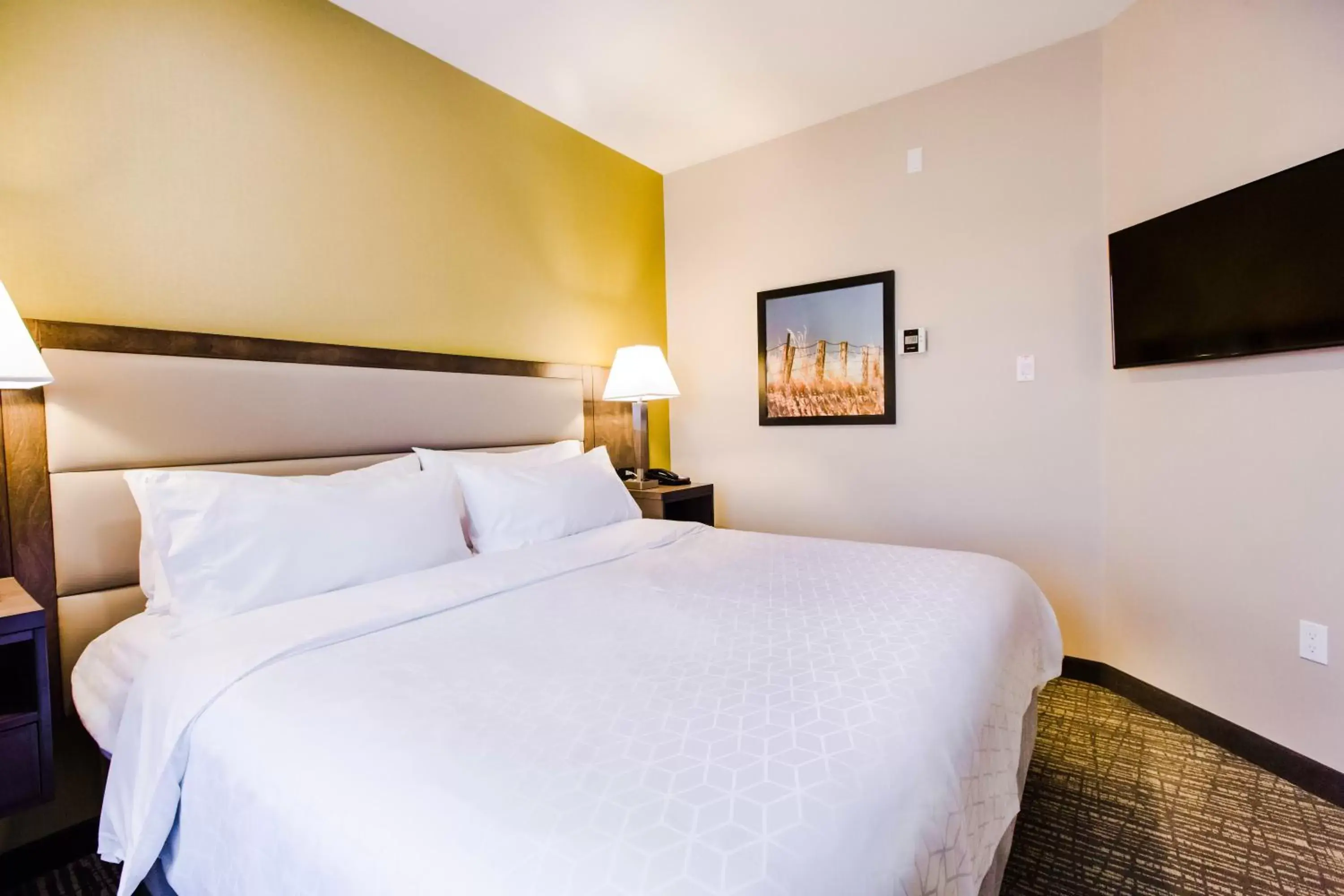 Bed in Candlewood Suites West Edmonton - Mall Area, an IHG Hotel