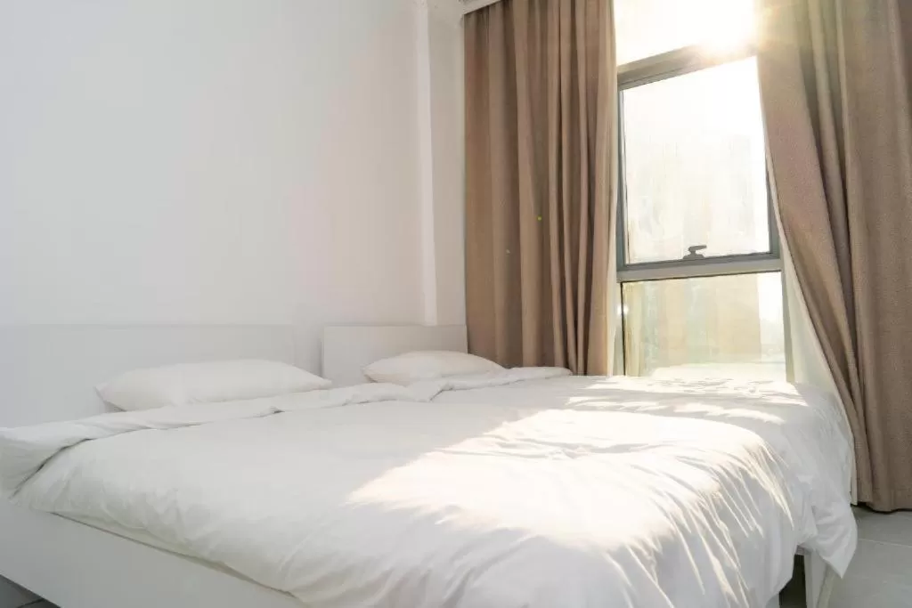 Bed in Atlantis Suites Hotel