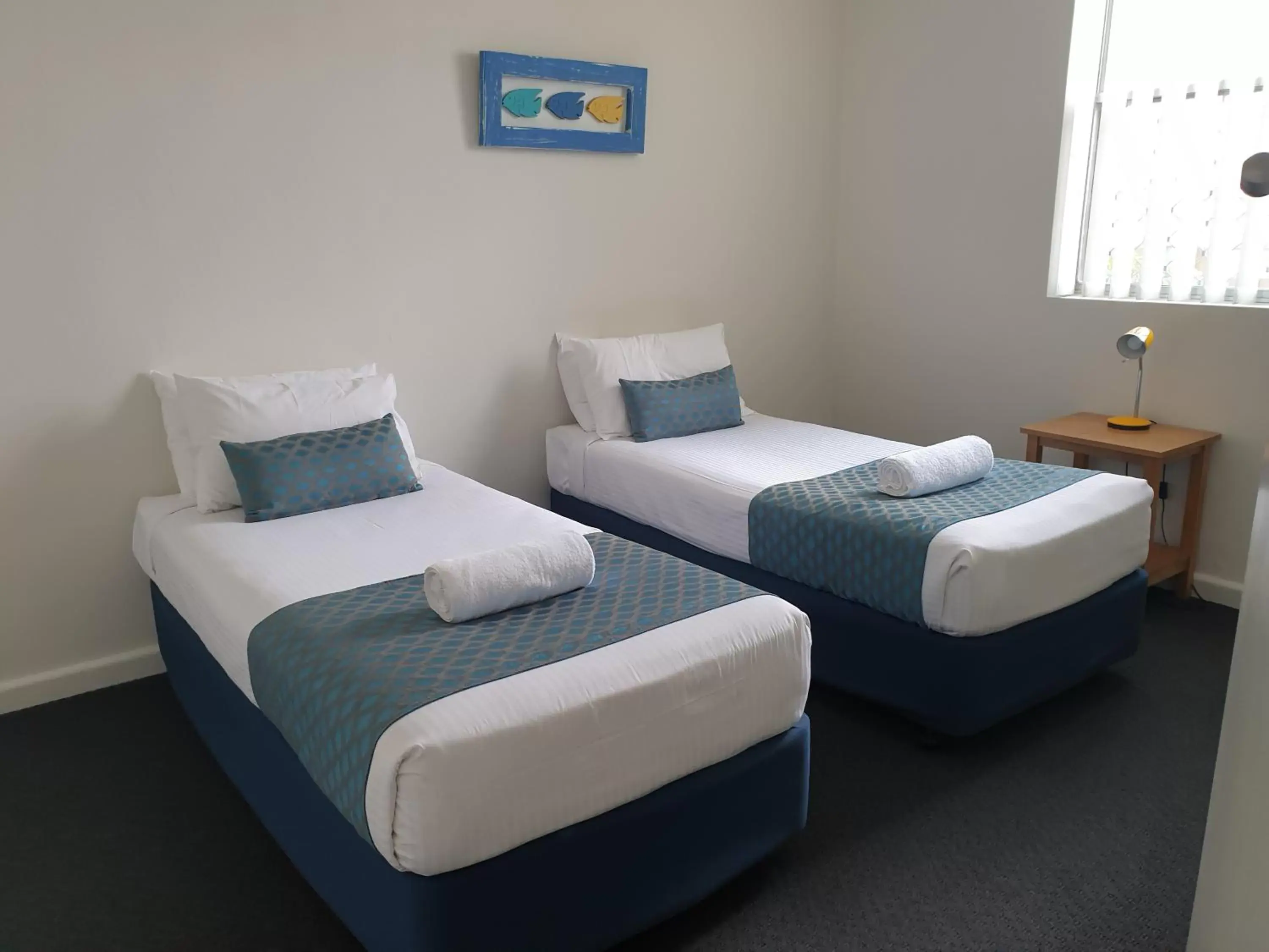 Bed in Oxley Cove Holiday Apartment