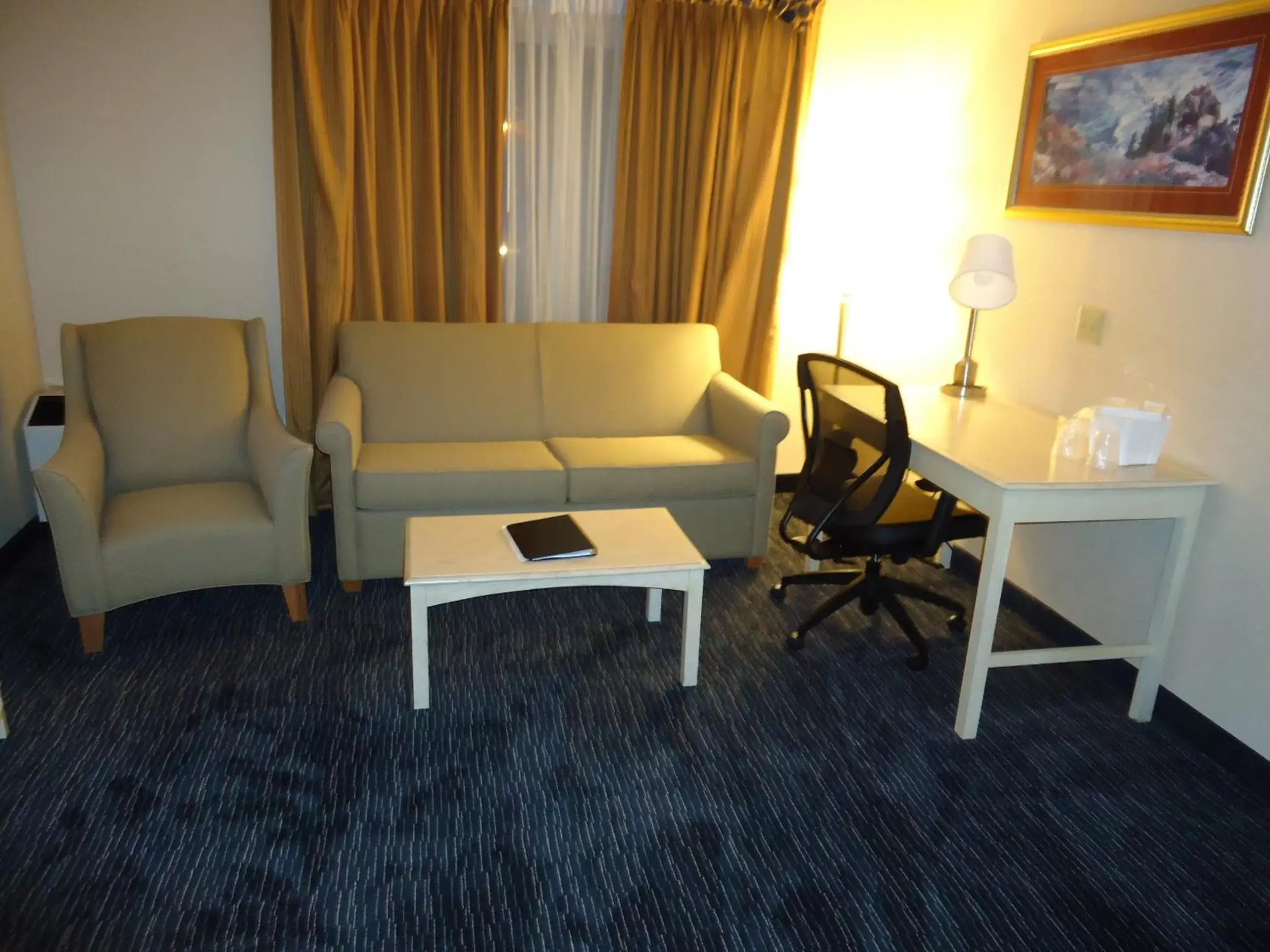 Living room, Seating Area in Ramada by Wyndham Trenton