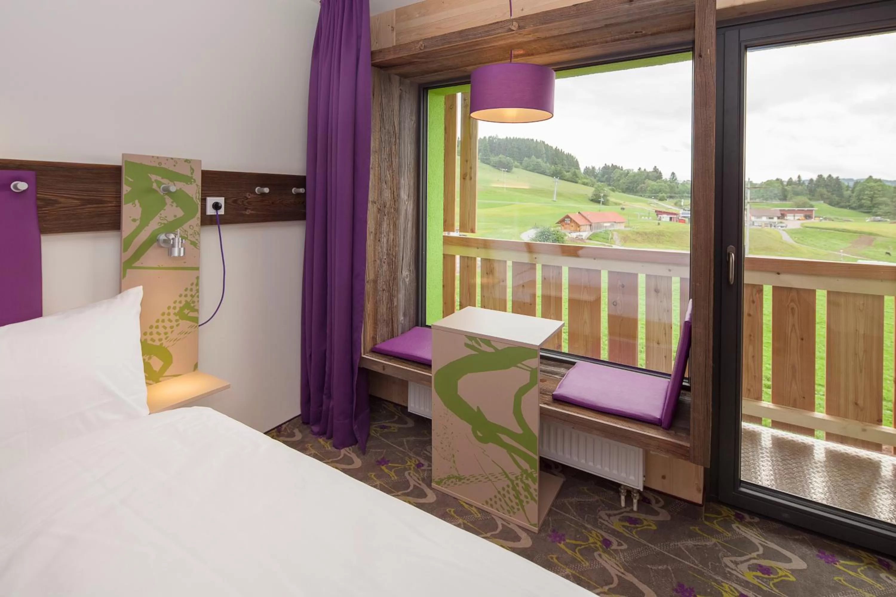 Living room, Bed in Explorer Hotel Neuschwanstein