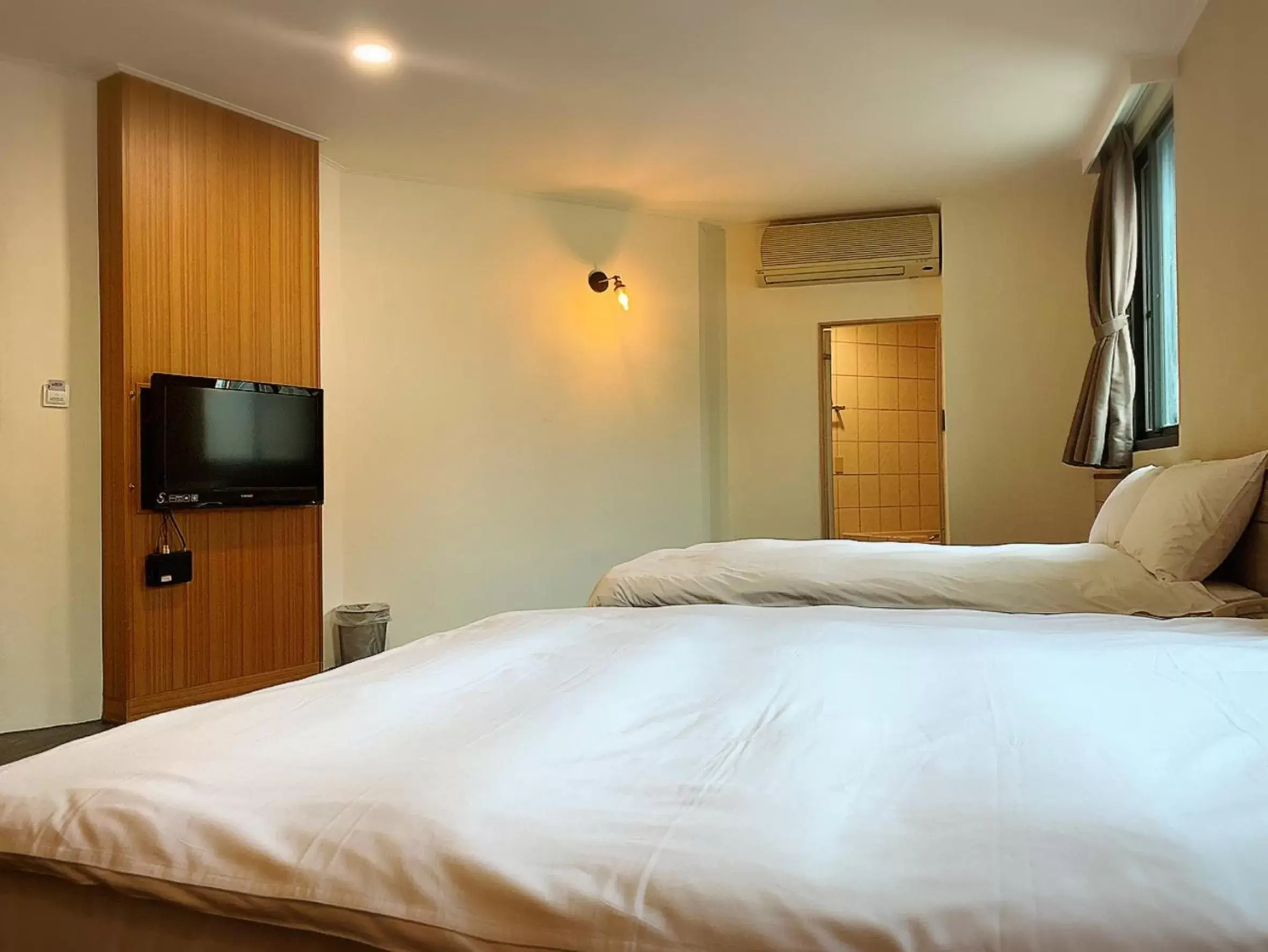 Bed in Raise Hotel Taichung