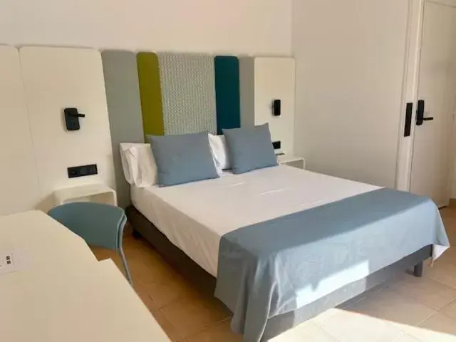 Bed in HOTEL BOUTIQUE CABO SUR