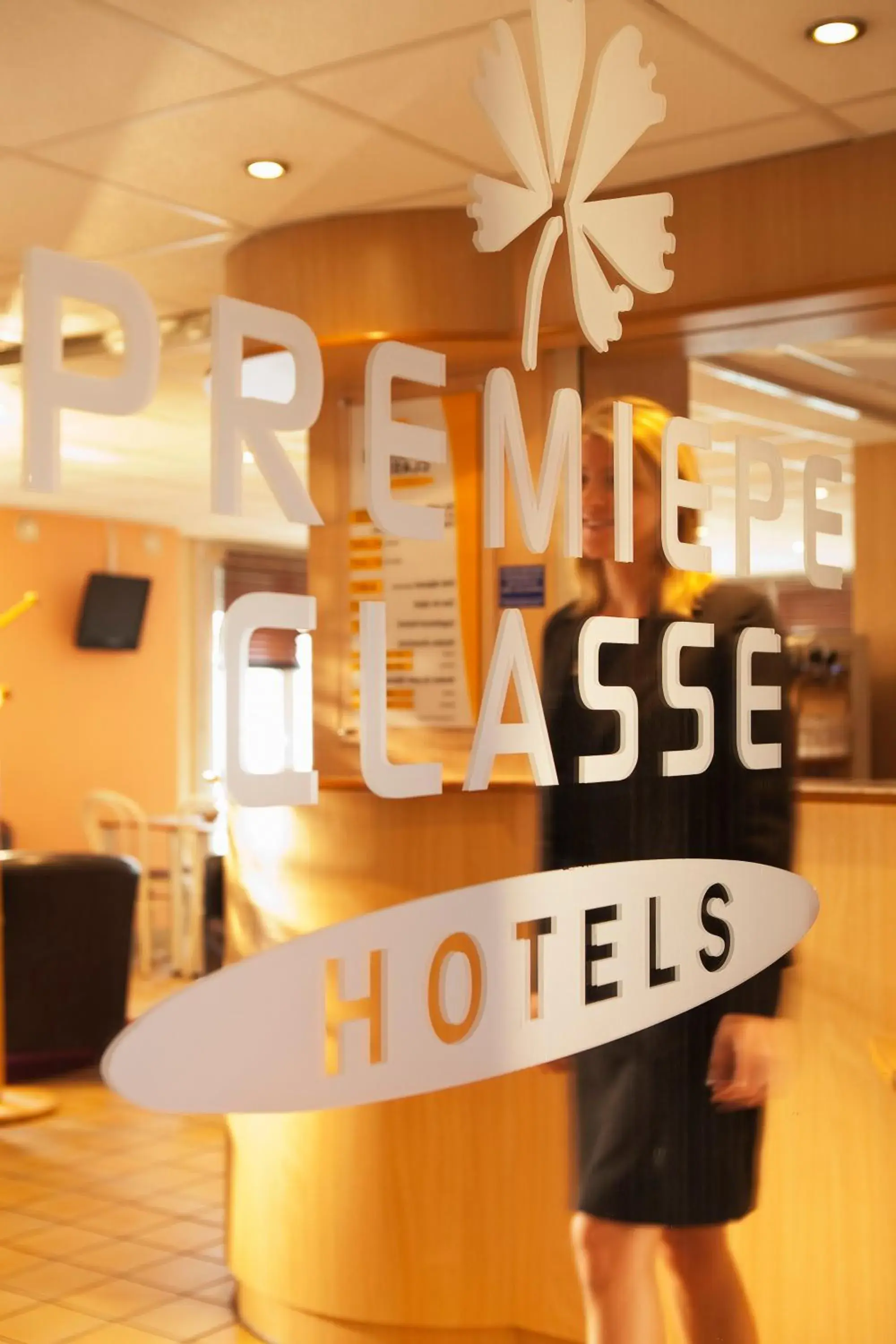 Property logo or sign in Premiere Classe Dreux