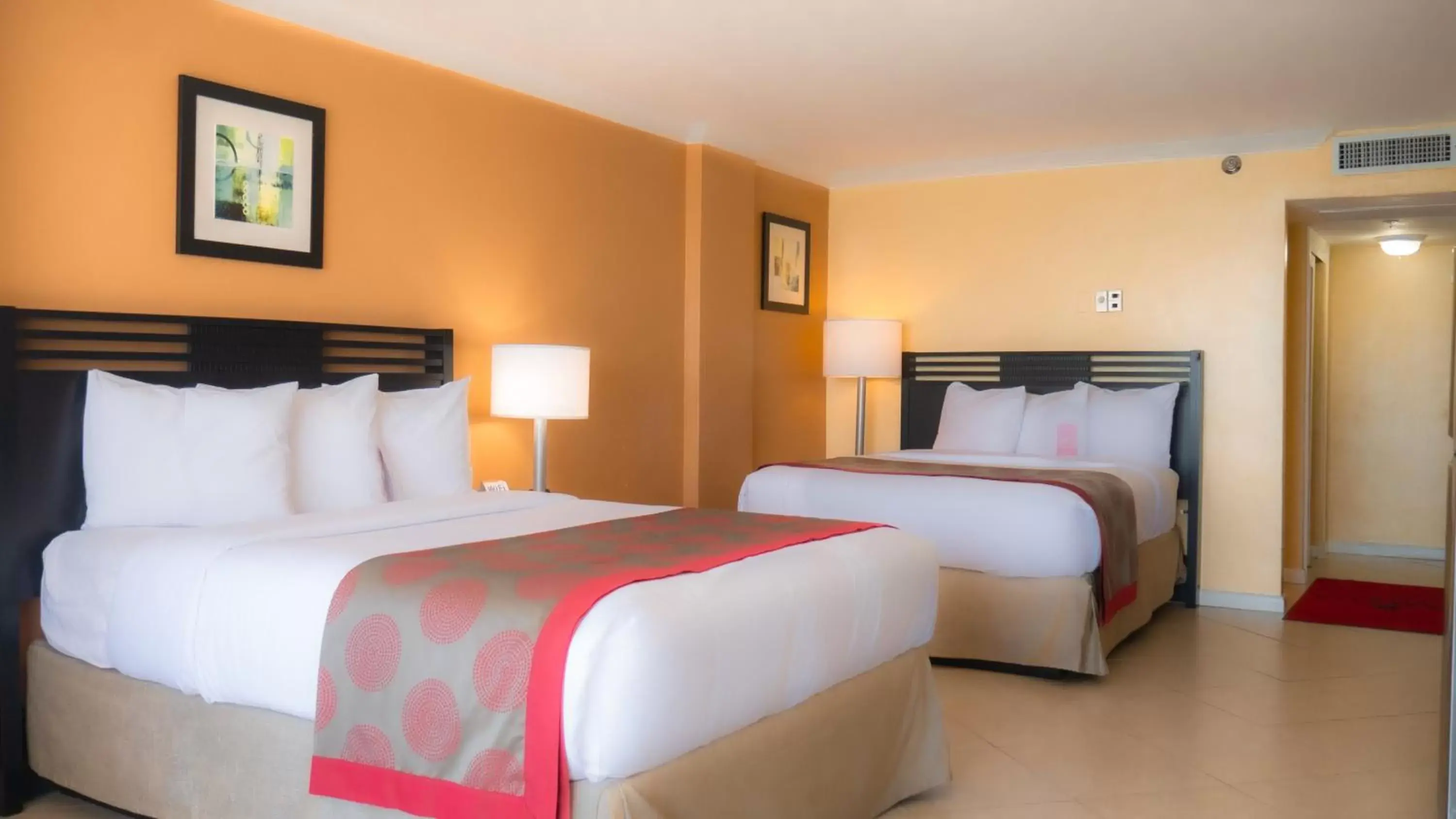 Bed in Ramada Plaza by Wyndham Marco Polo Beach Resort