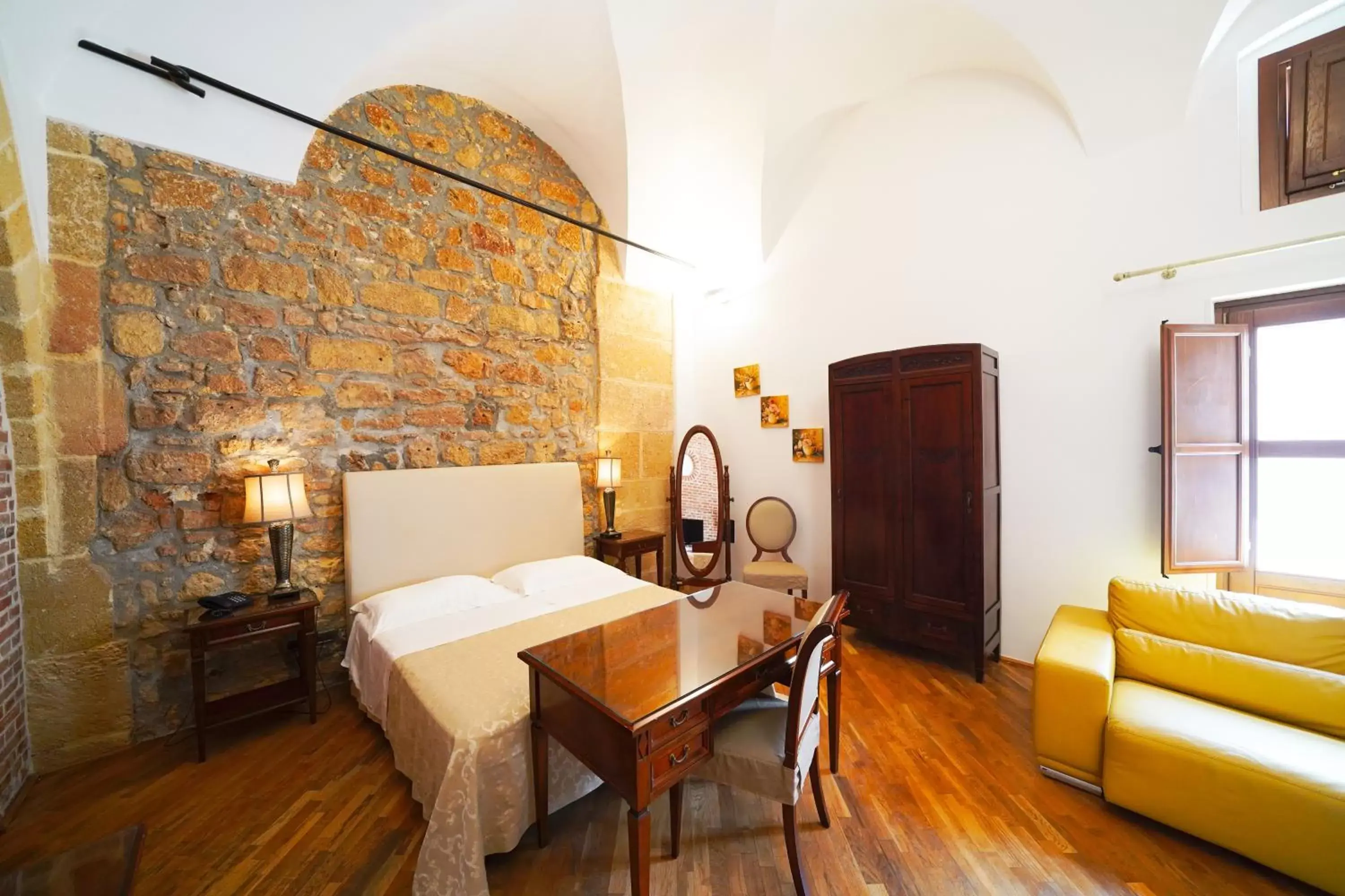 Bedroom, Dining Area in Hotel Carmine