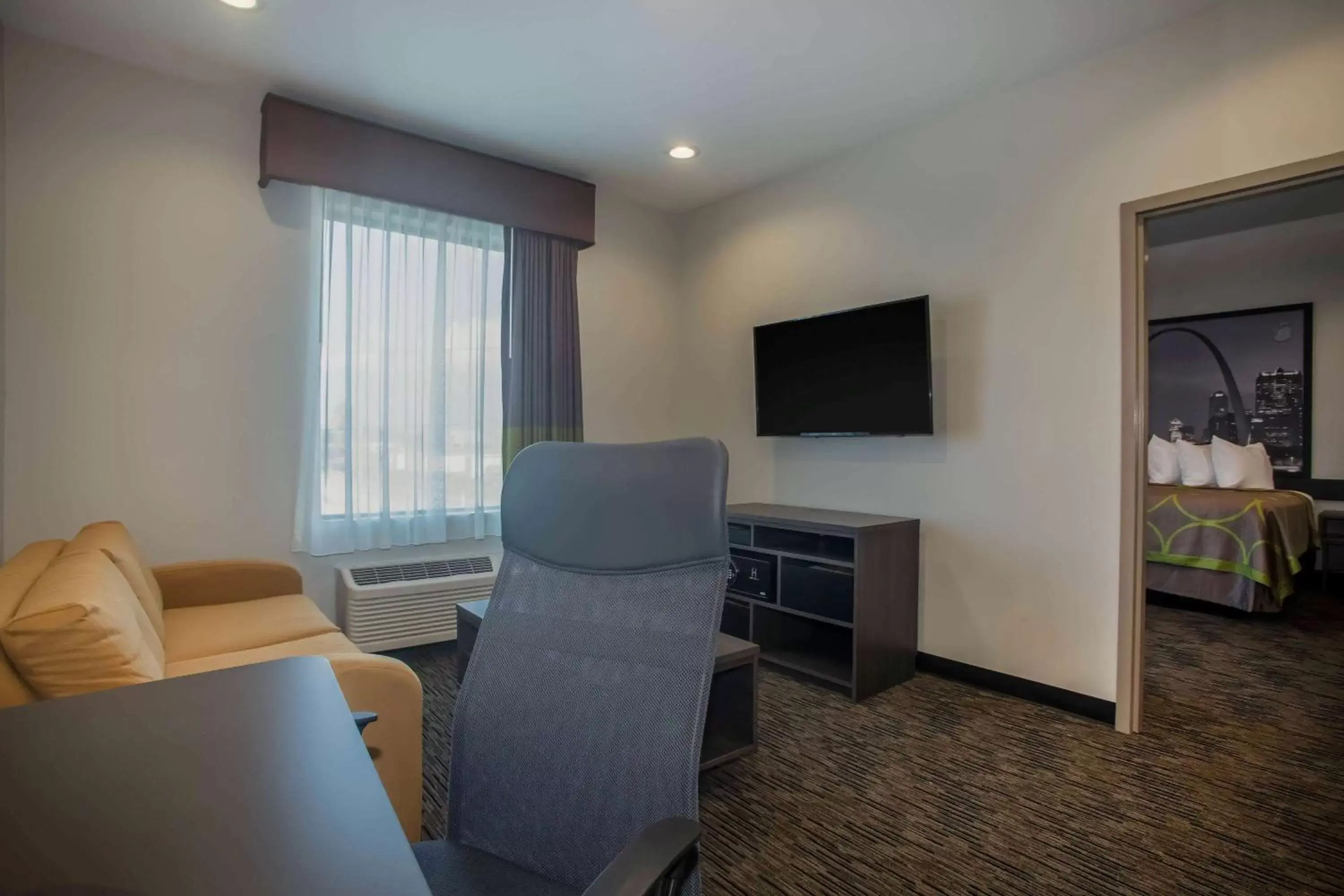 Photo of the whole room, TV/Entertainment Center in Super 8 by Wyndham St. Louis North