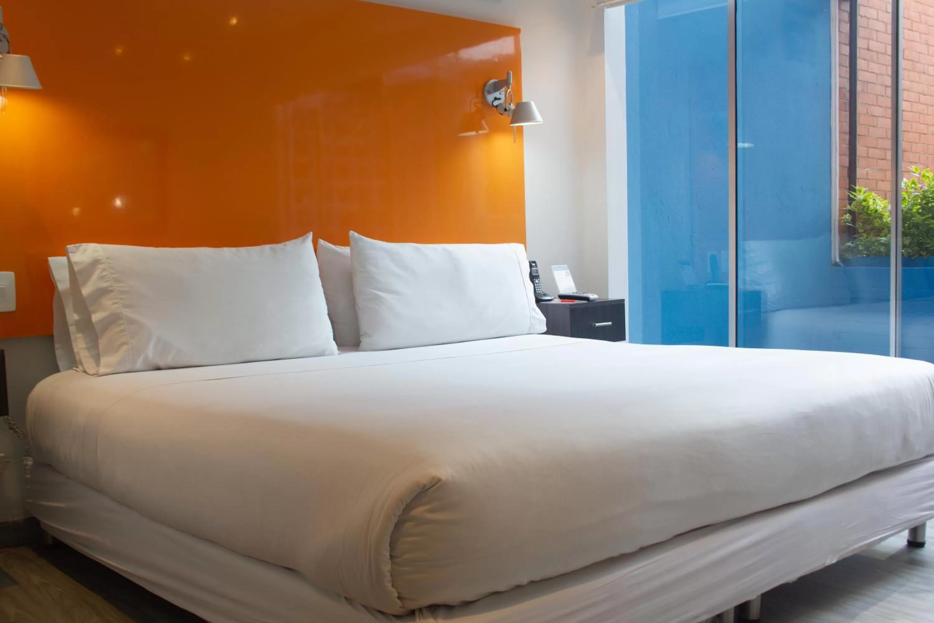 Bed in Hotel 104 Art Suites