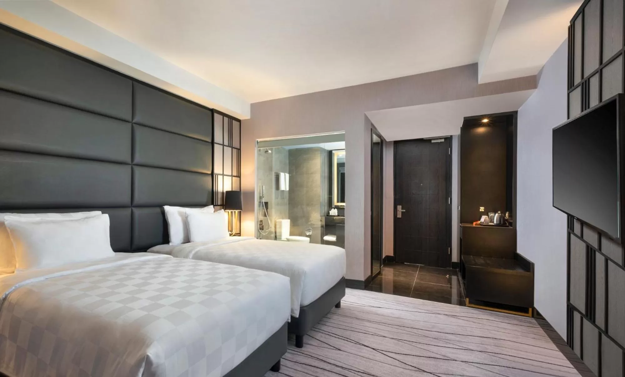 Bed in Grand Swiss-Belhotel Darmo