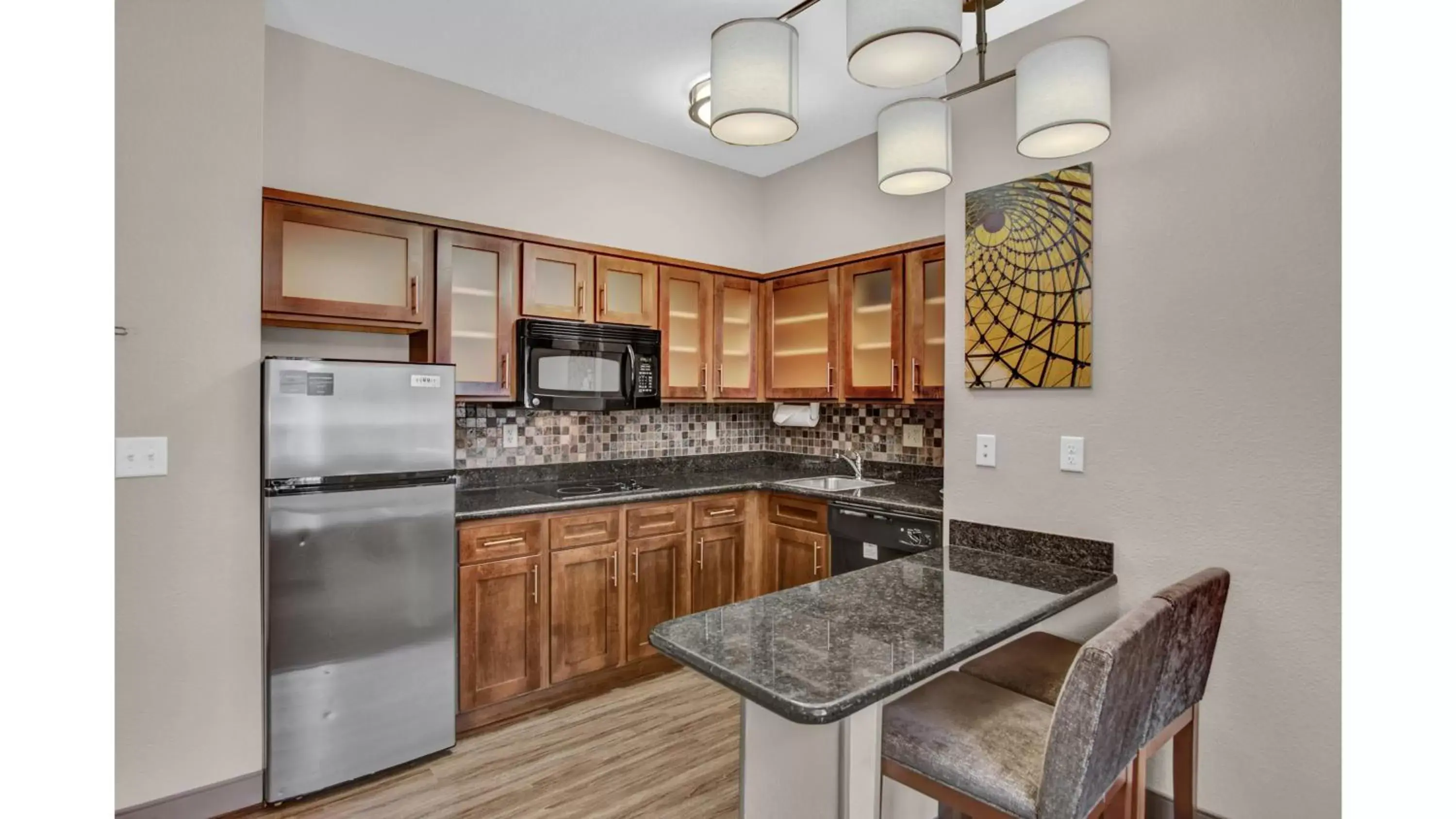 Photo of the whole room, Kitchen/Kitchenette in Staybridge Suites Salt Lake-West Valley City, an IHG Hotel