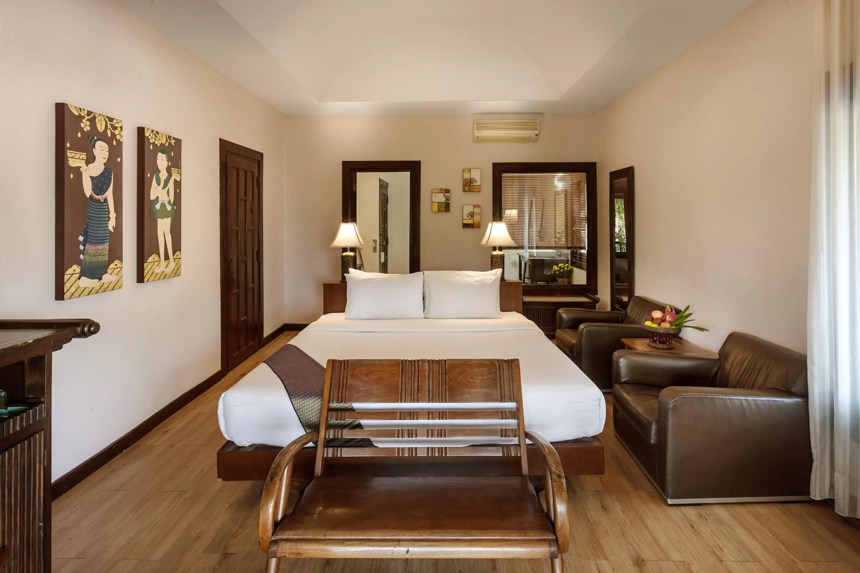 Bed in Lanna Dusita Riverside Boutique Resort