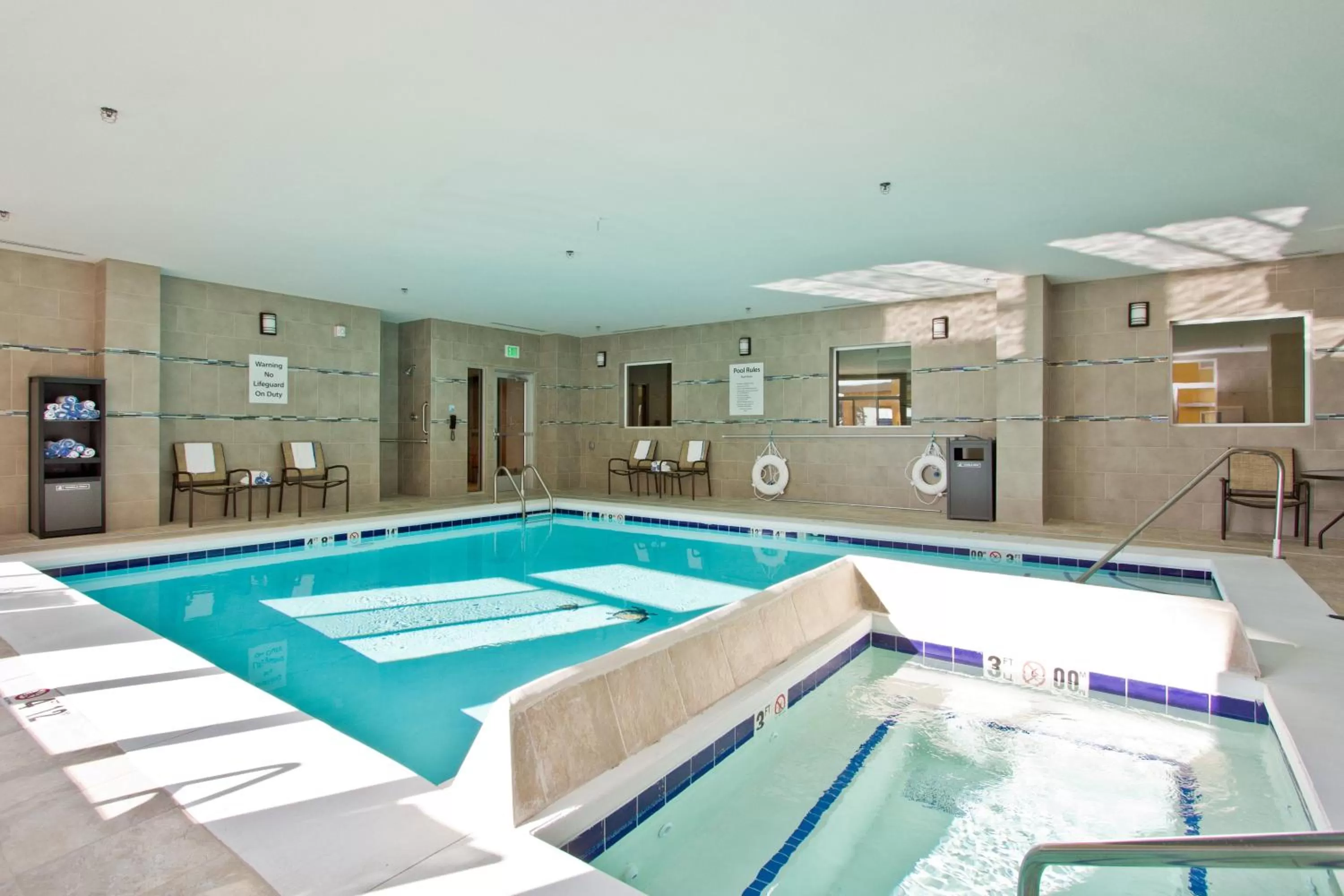 Swimming pool in Holiday Inn Express and Suites Denver East Peoria Street by IHG